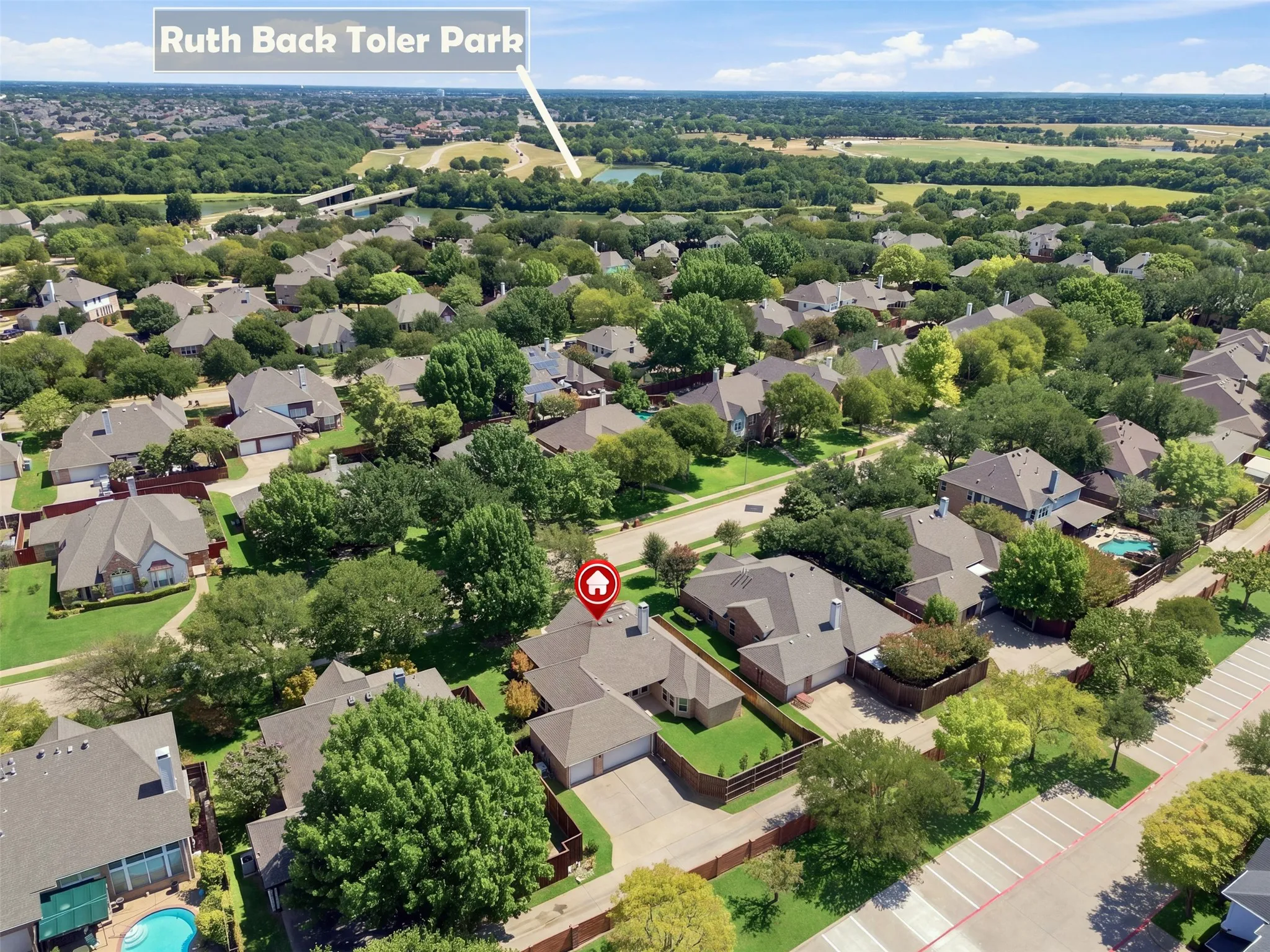 Residential neighborhood with mature trees, green spaces, and community infrastructure.