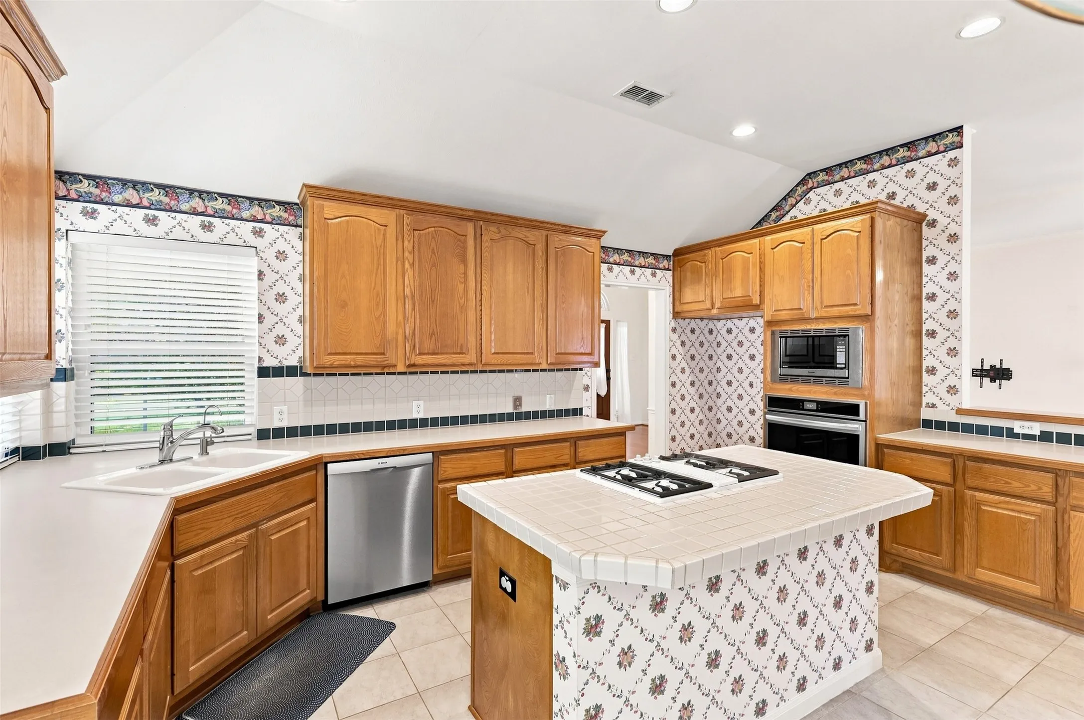 Plenty of counter space for meal prep and island allows for bar stools for early morning breakfast.