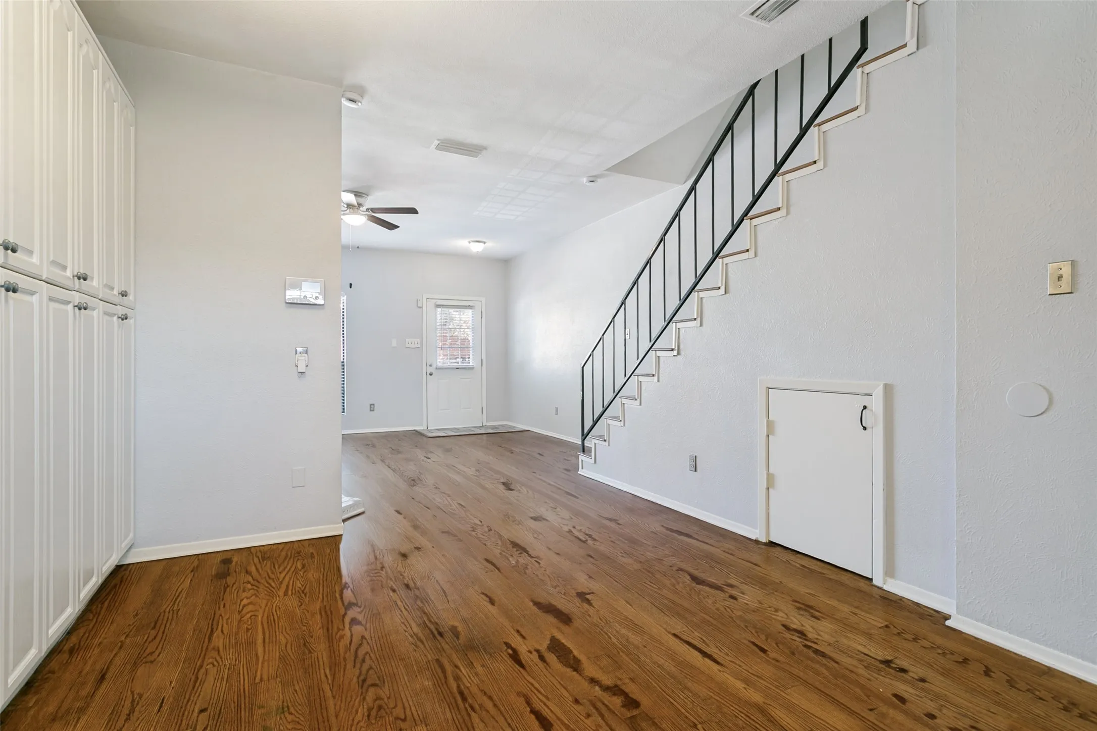 Wall of cabinets in dining area