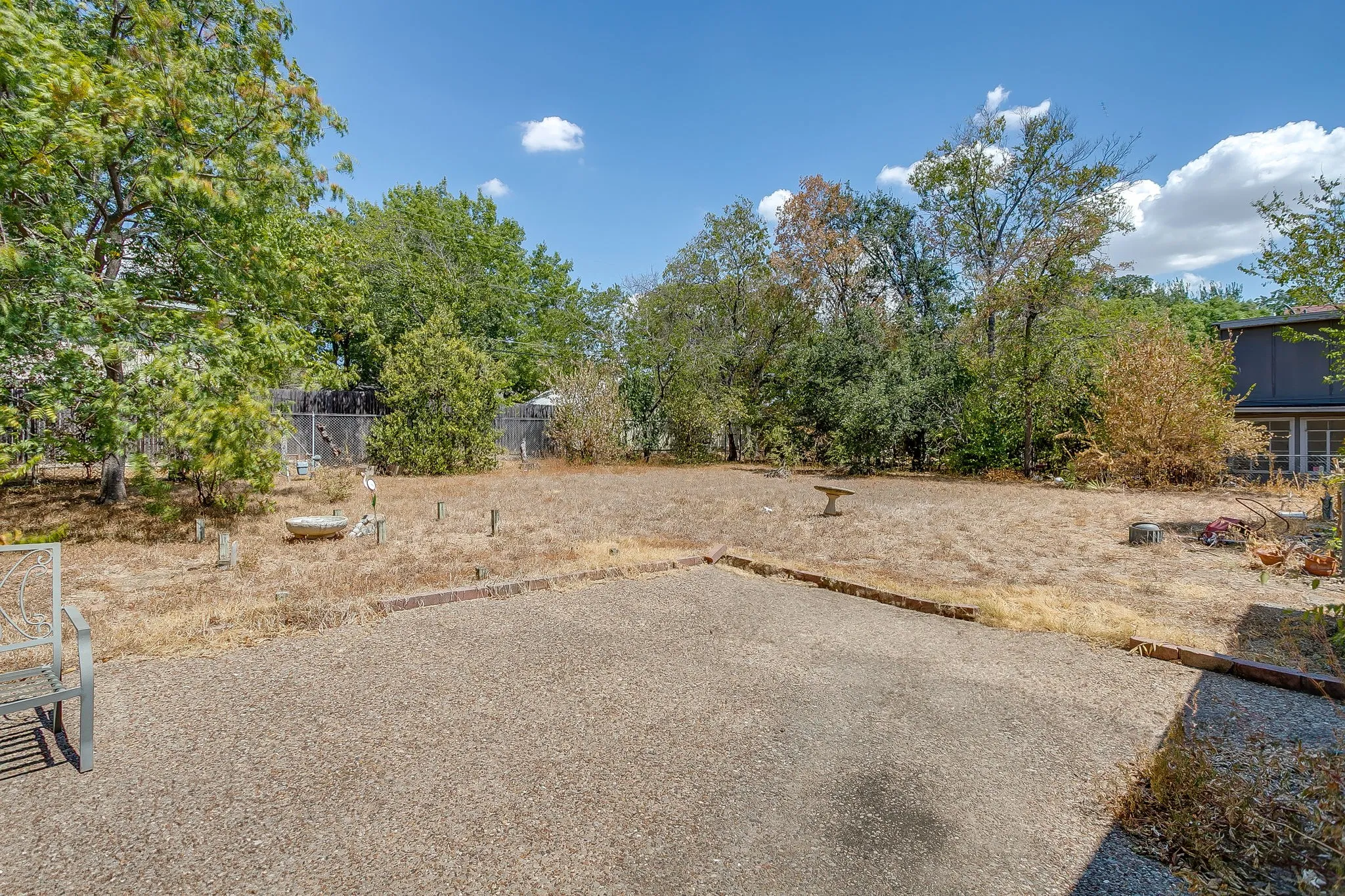 View of yard from concrete patio