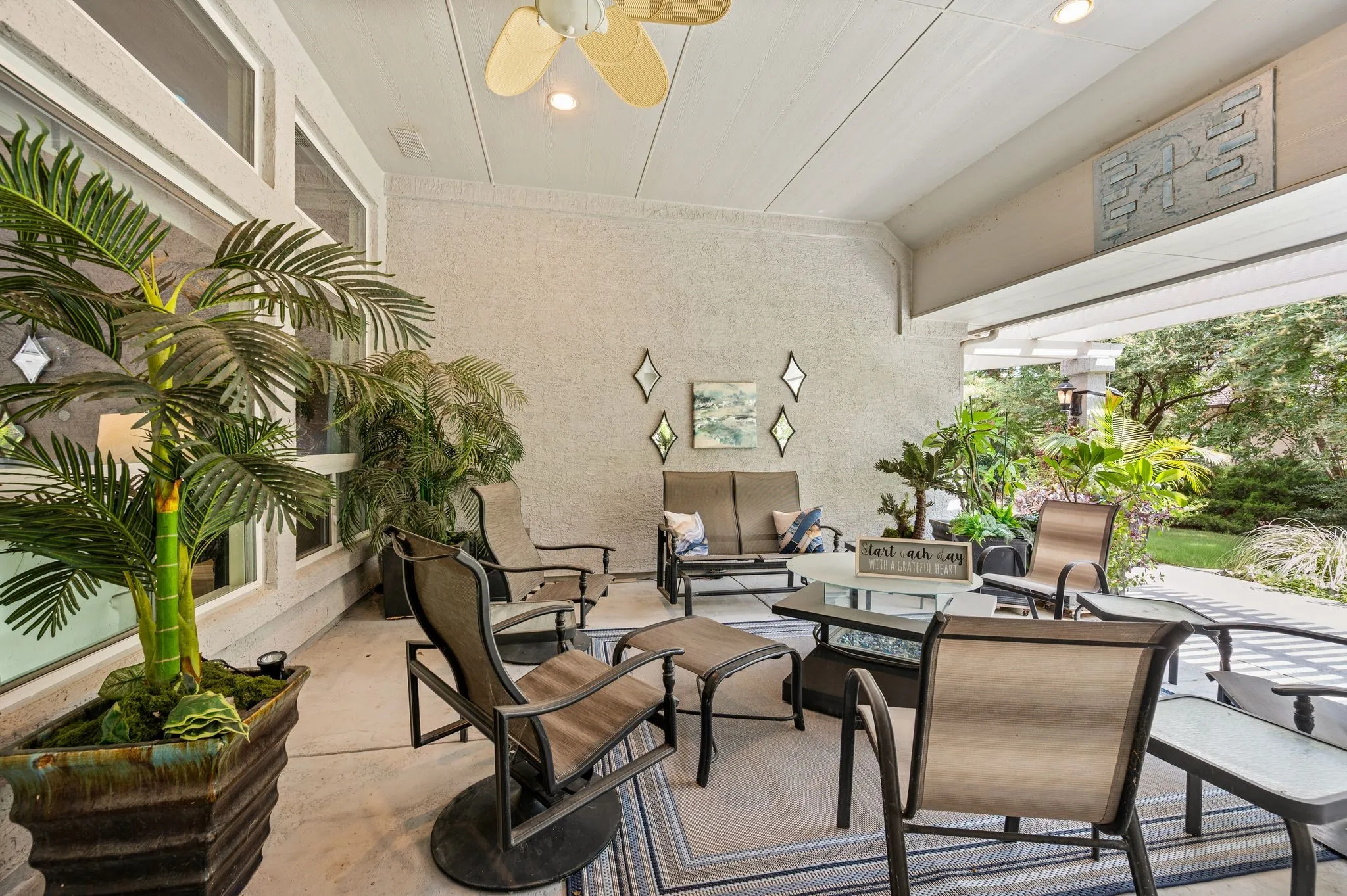 Covered patio with a textured ceiling, recessed lighting, and a ceiling fan