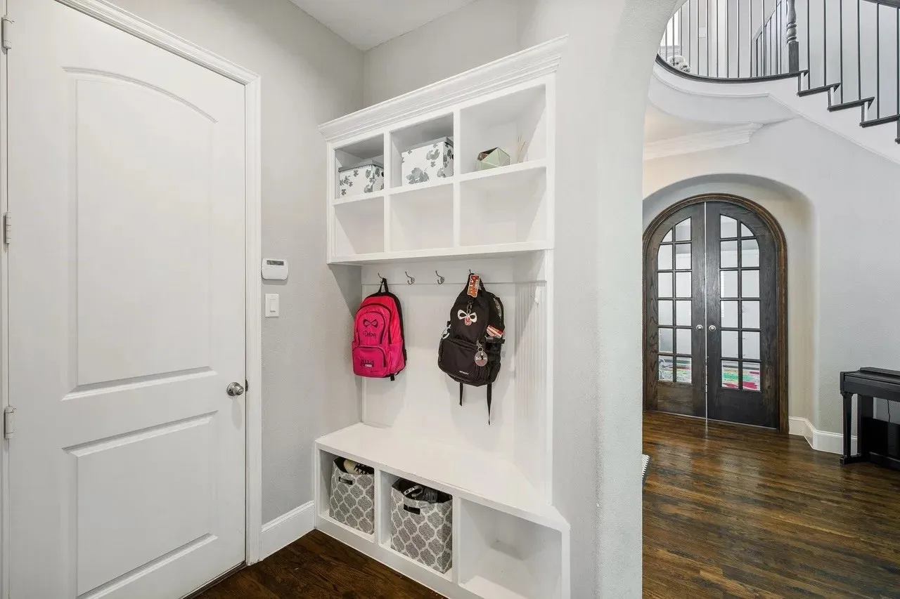 Built-in mudroom storage with integrated bench seating and shelving