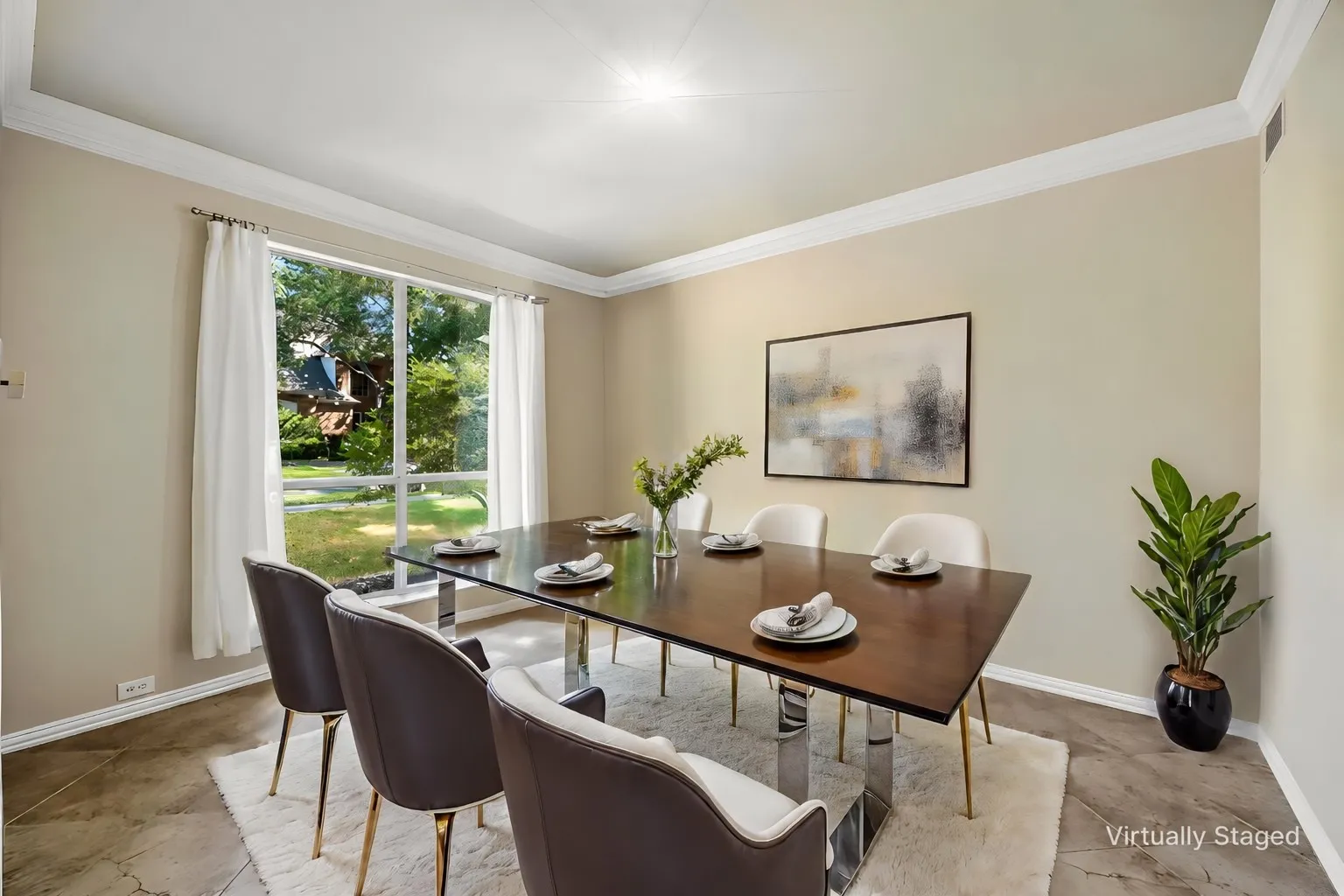 Crown molding, light neutral wall tones, and large window with exterior landscaping