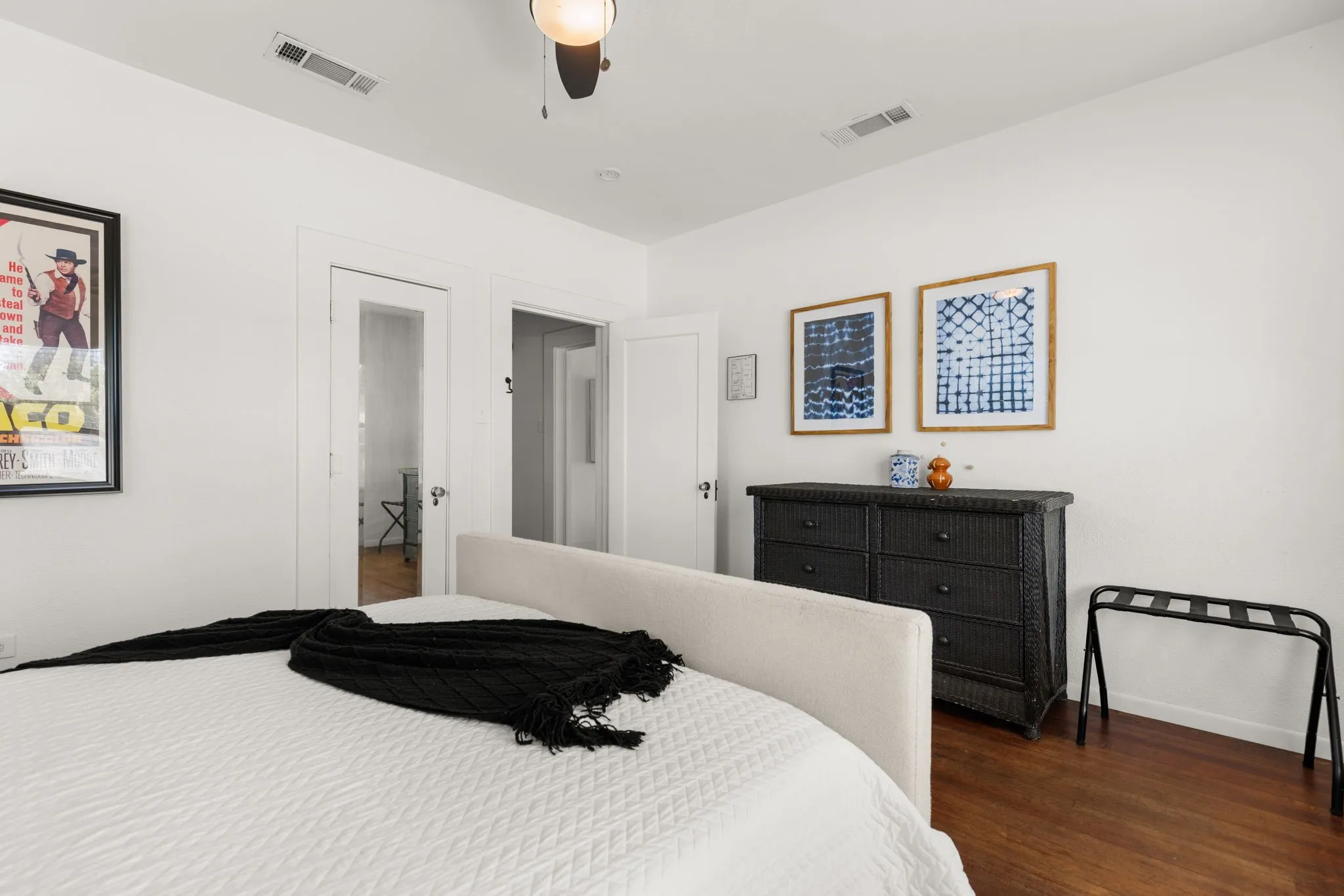 White walls with dark wood-finish flooring