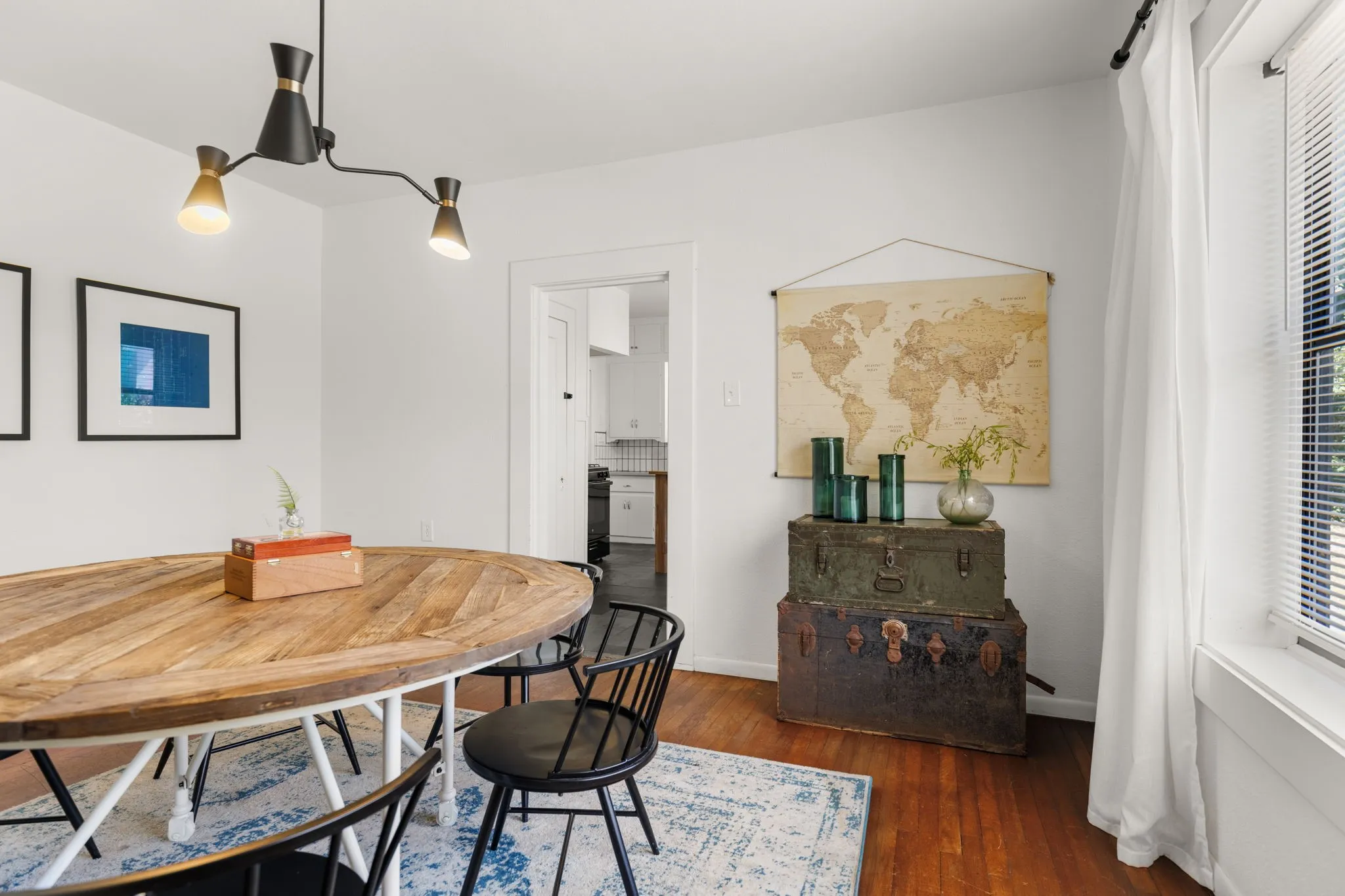 Hardwood flooring, white walls, recessed window, and overhead lighting