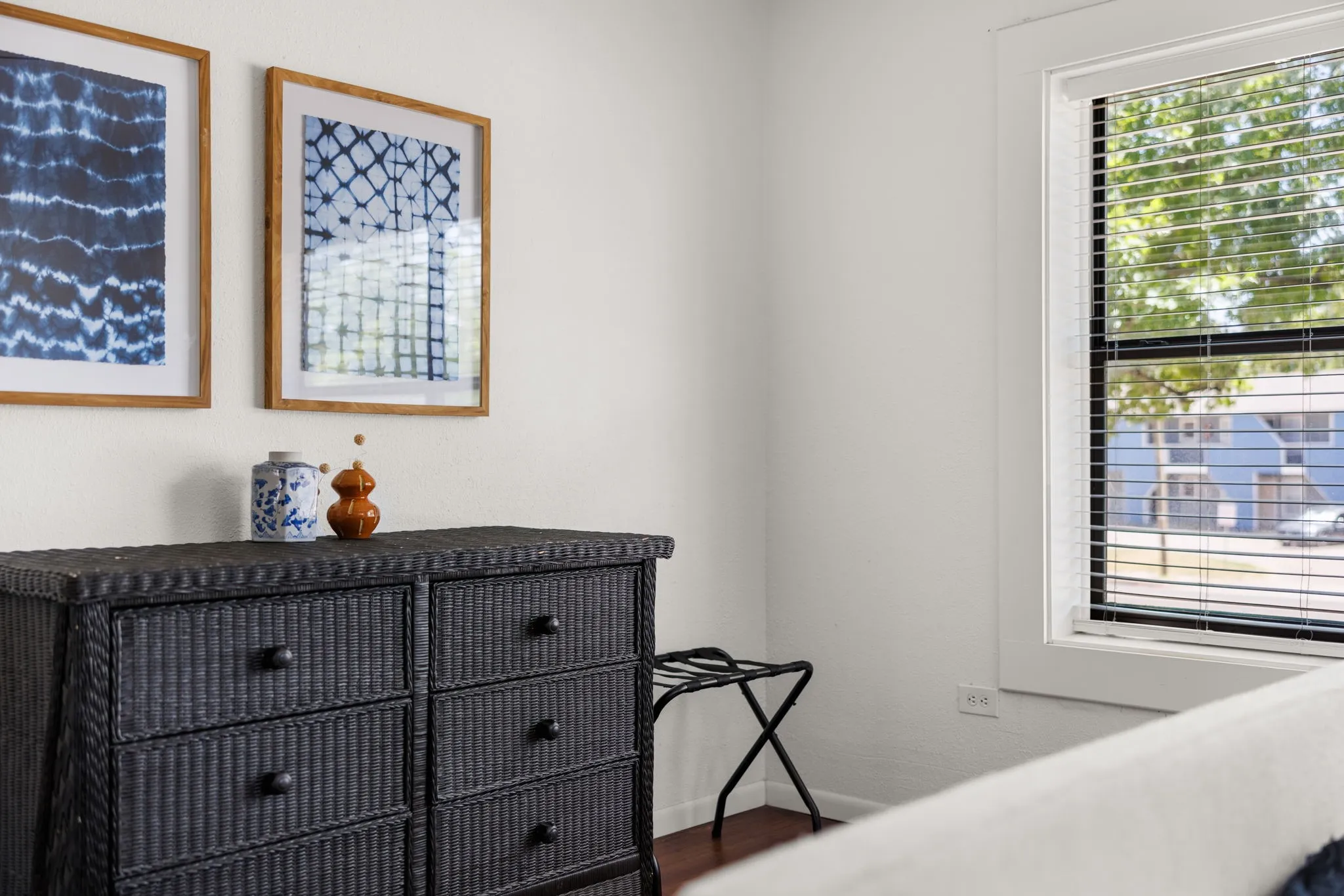White interior walls and dark wood-finish flooring