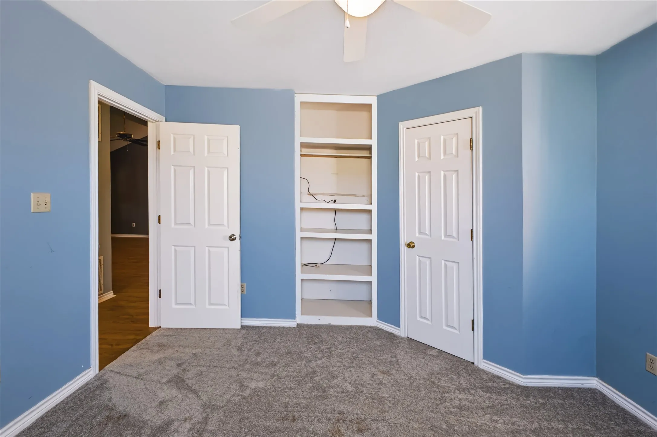 Bedroom 1 has built-in shelves.