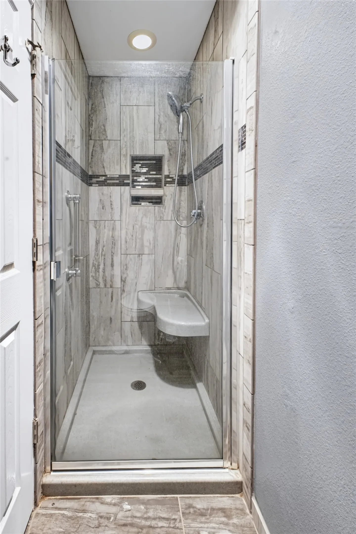 Separate shower area in primary bathroom.