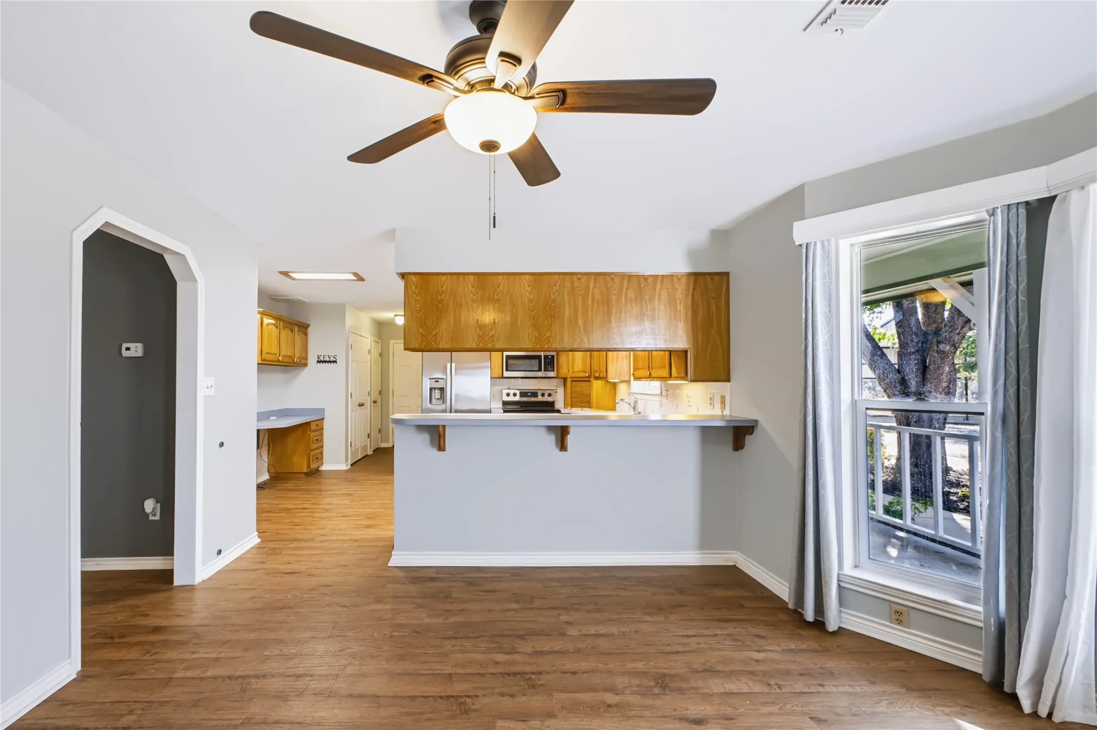Kitchen has bar seating.