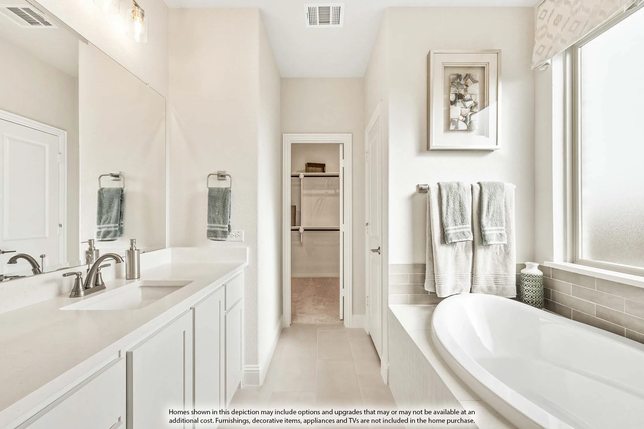 Dual vanity with undermount sinks, brushed nickel fixtures, and light-toned countertops