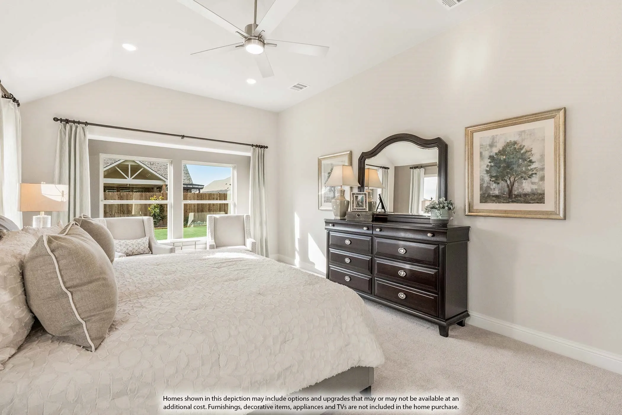 Vaulted ceiling with a ceiling fan and recessed lighting