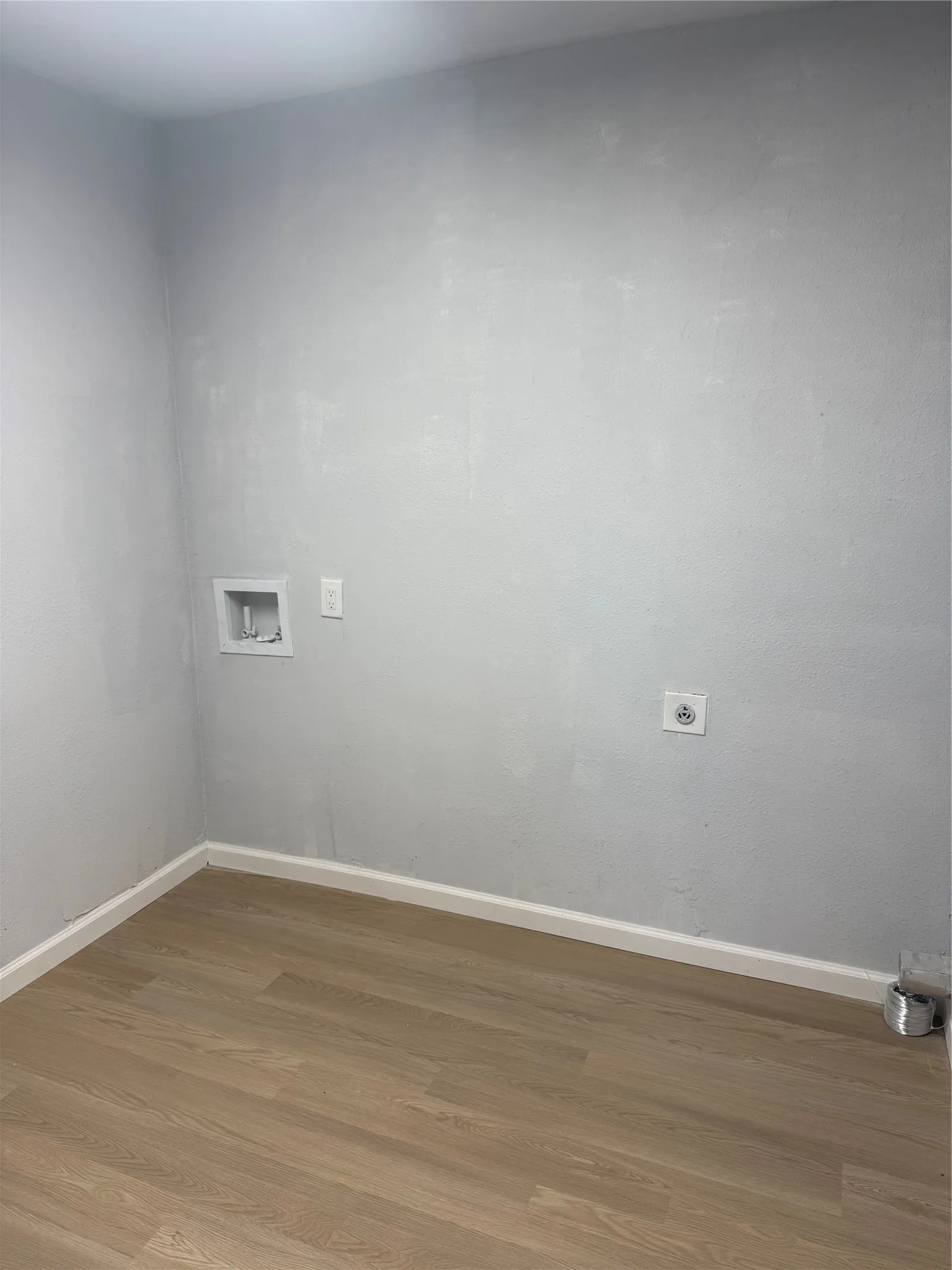 Wood-finish flooring with light-toned walls