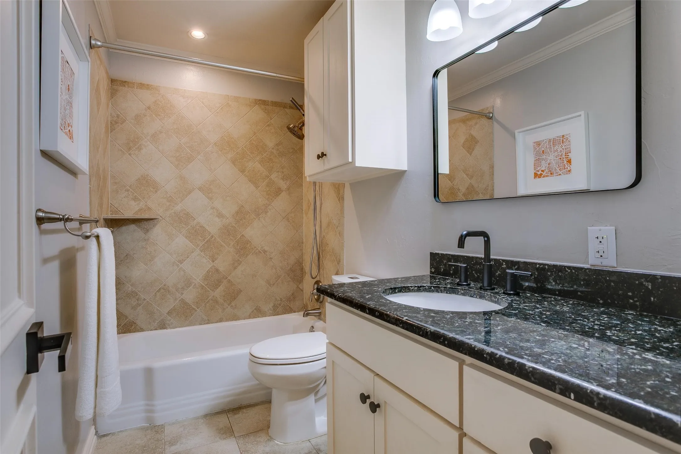Third fully renovated bath serves the secondary bedrooms.
