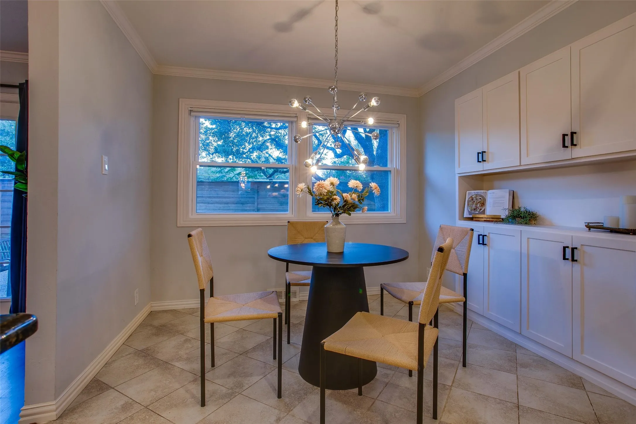 Breakfast Room provides an inviting spot for casual dining just off the Kitchen, and features beautiful built-ins and cookbook storage.