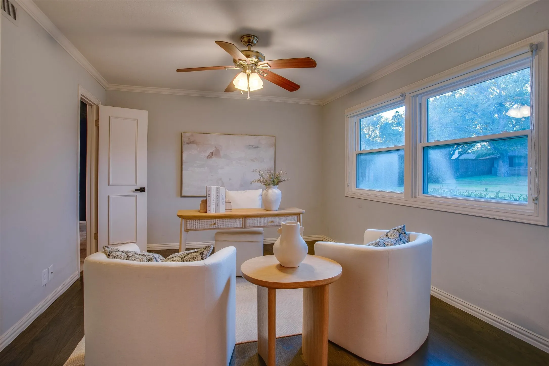 Dedicated Home Office behind French doors, one of three distinct living areas. Adjacent full bath.