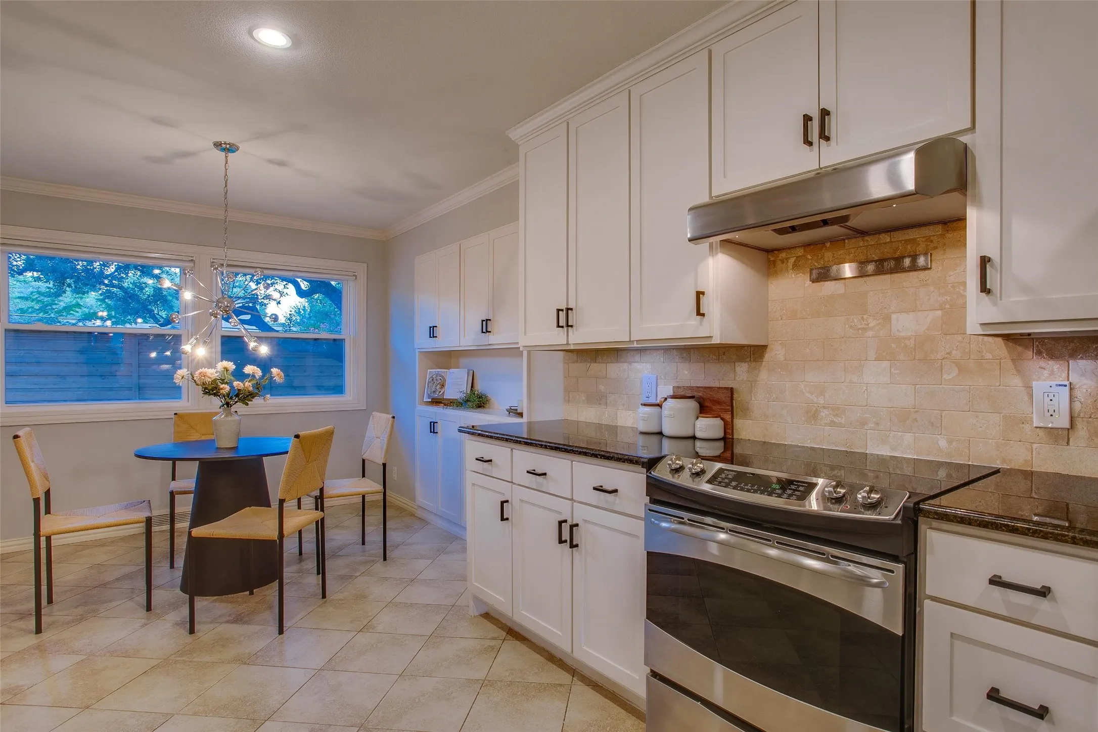 Premium stainless range, custom cabinetry and generous counter space.
