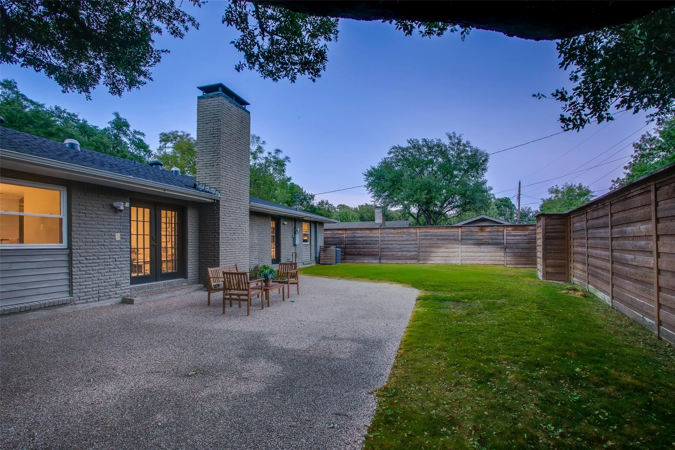 Generous backyard combines open lawn, entertaining space and privacy.
