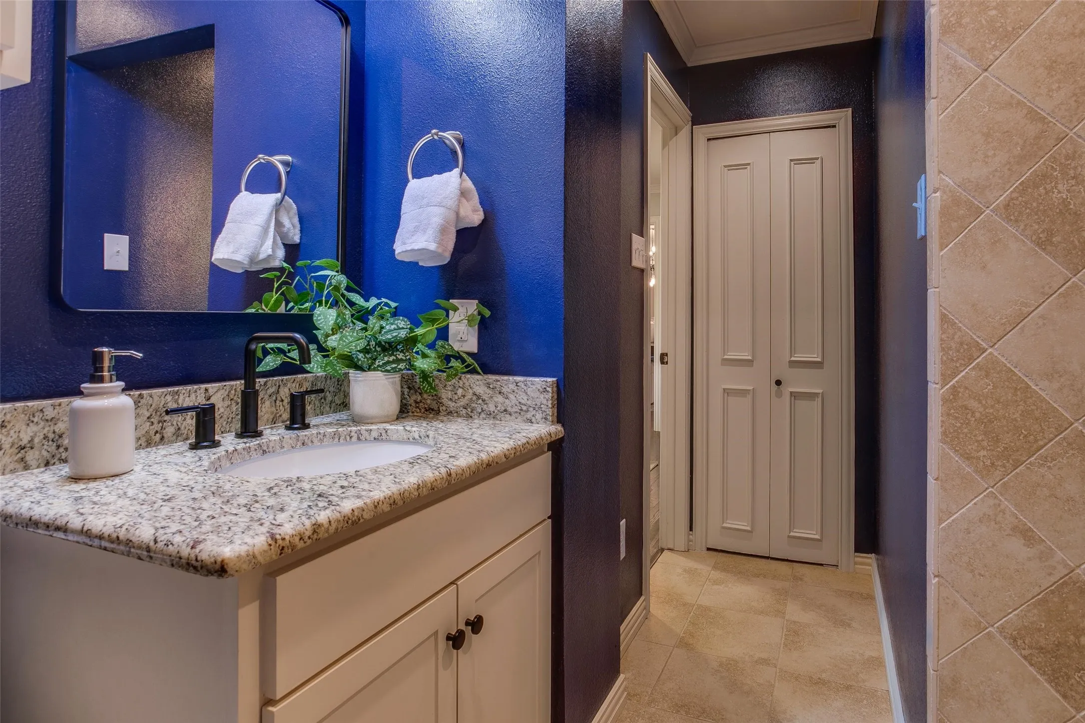 Fully renovated bath conveniently located between the Family Room and dedicated Home Office.