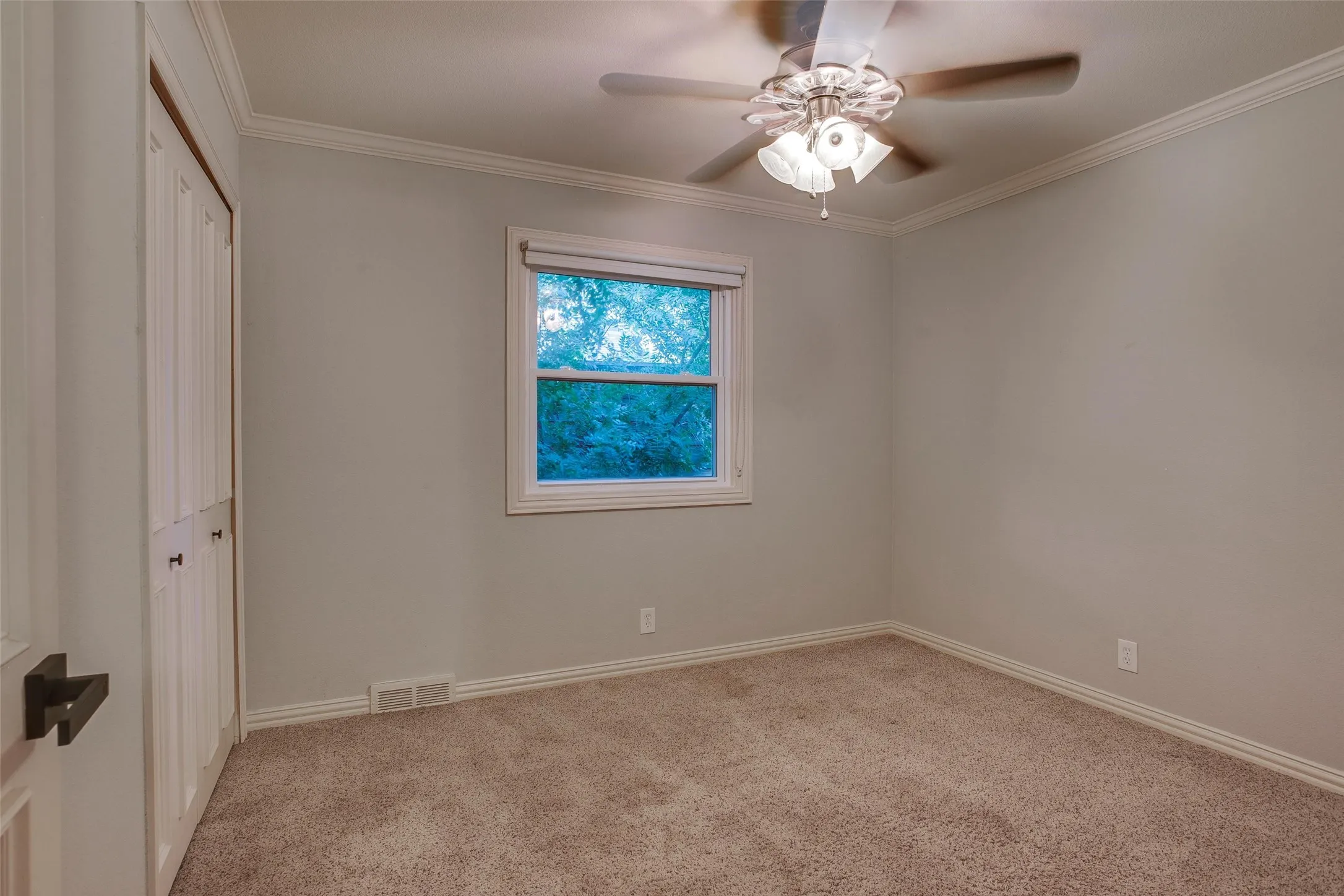 Bedroom 2, one of three secondary bedrooms.
