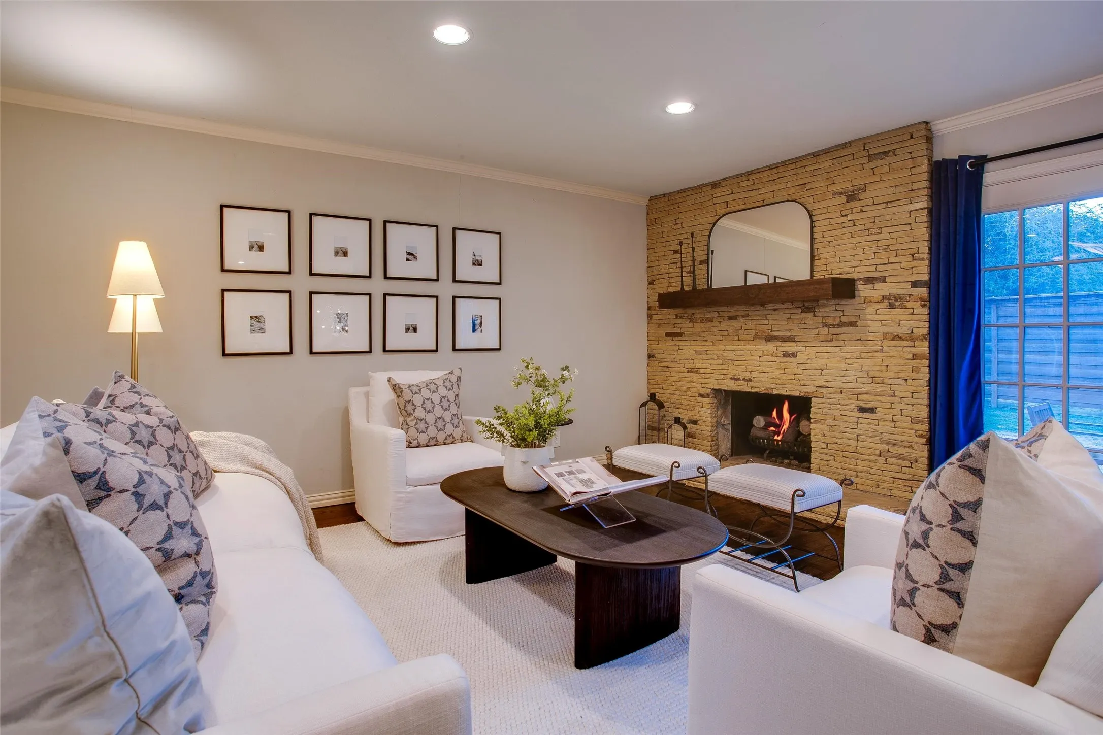 Main Living Room anchored by the home's original stone fireplace wall.