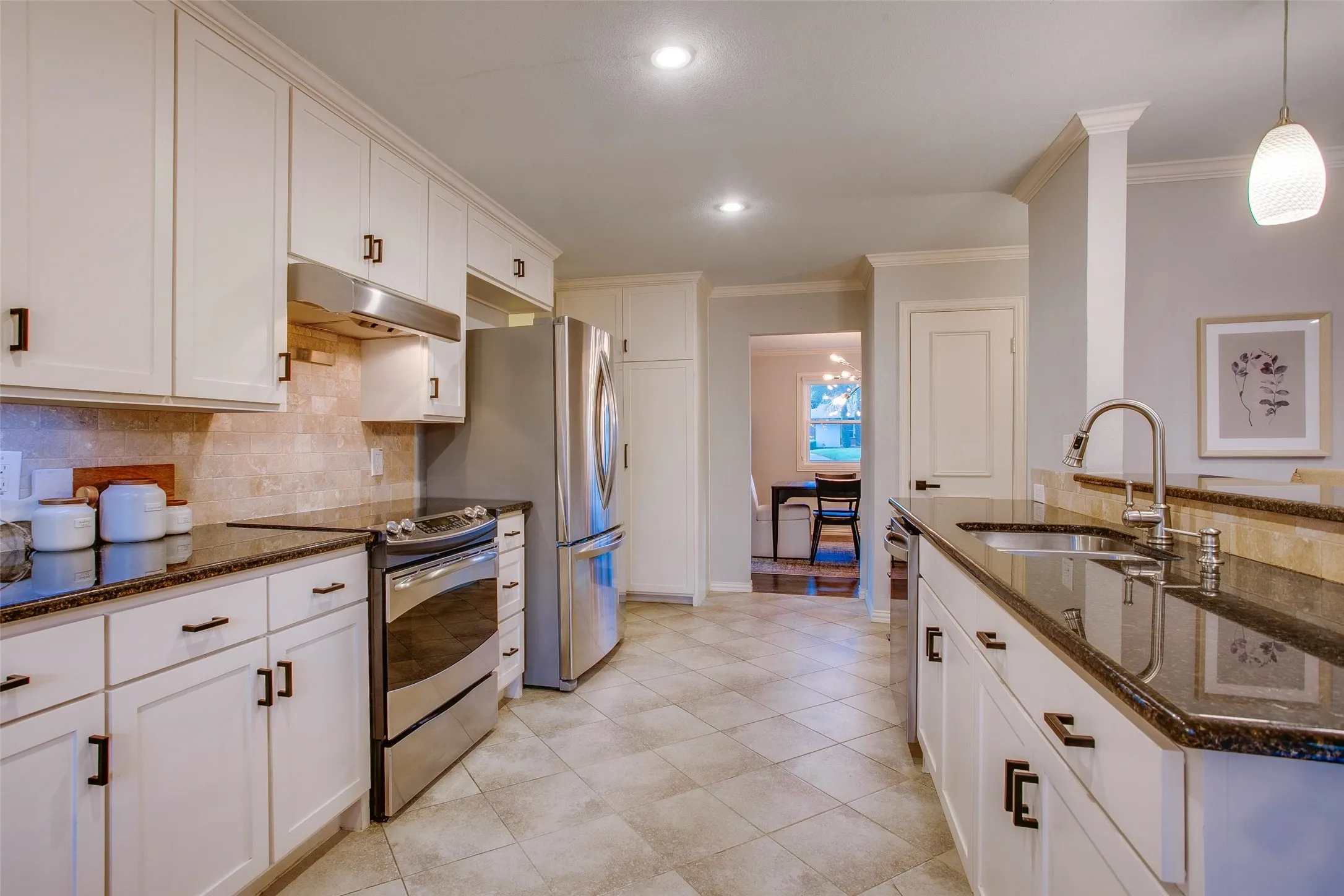 Large Kitchen creates an easy connection between cooking, gathering and entertaining spaces.