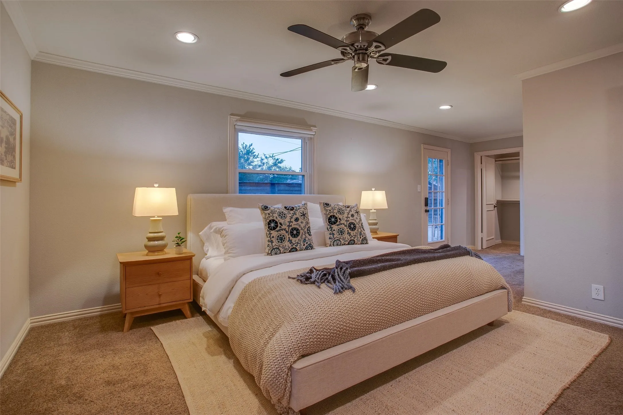 Generous Primary Bedroom with backyard access and room for substantial furnishings.