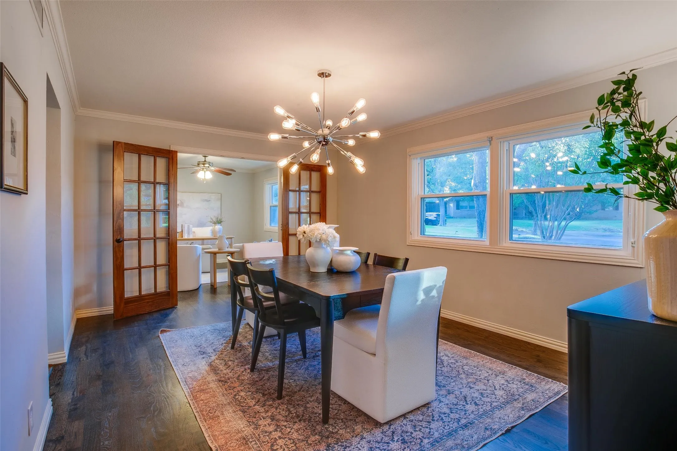 Dining room with hardwood flooring, abundant natural light and French doors to the adjoining Home Office.