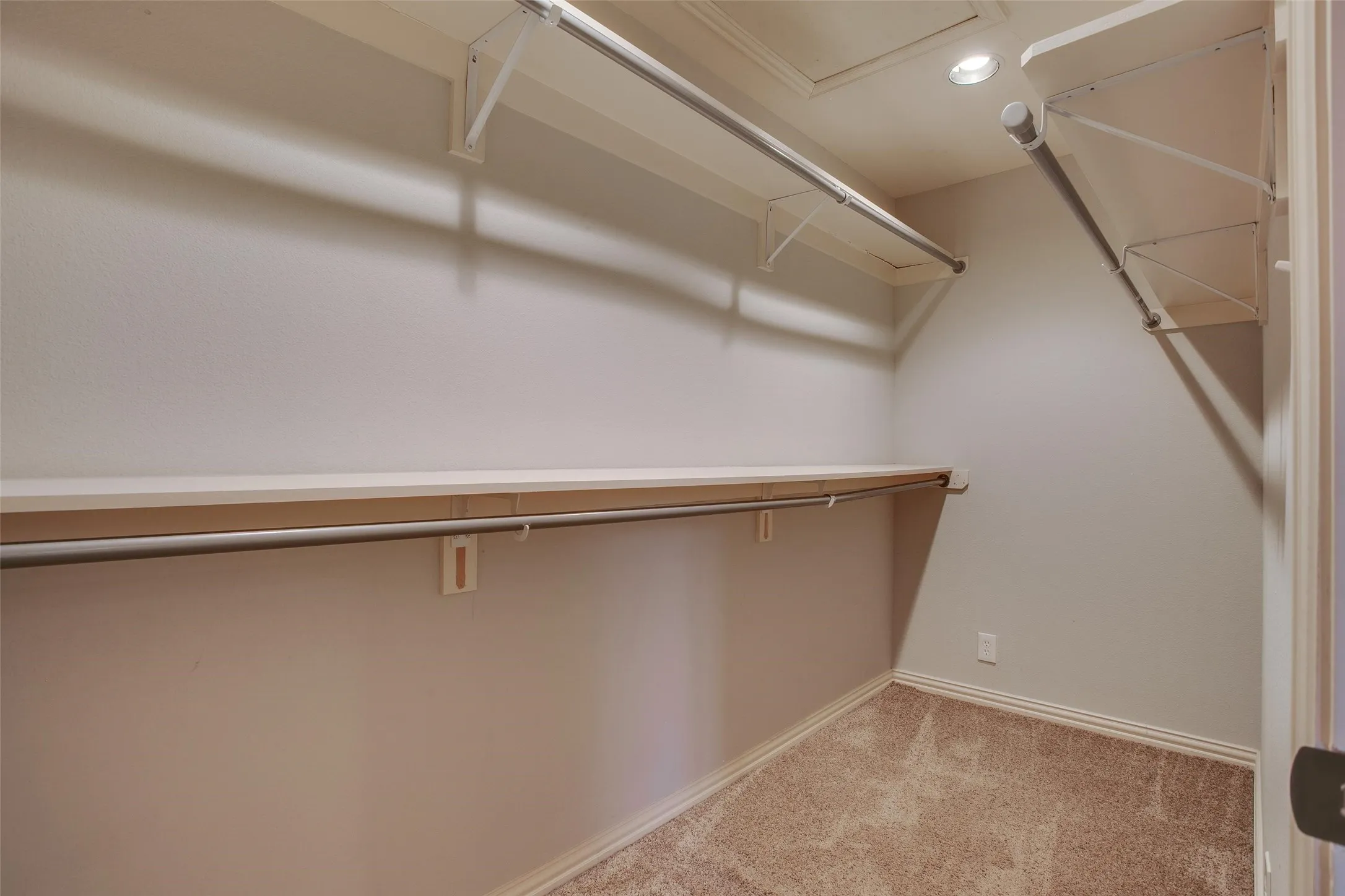 One of two walk-in closets within the Primary Suite.