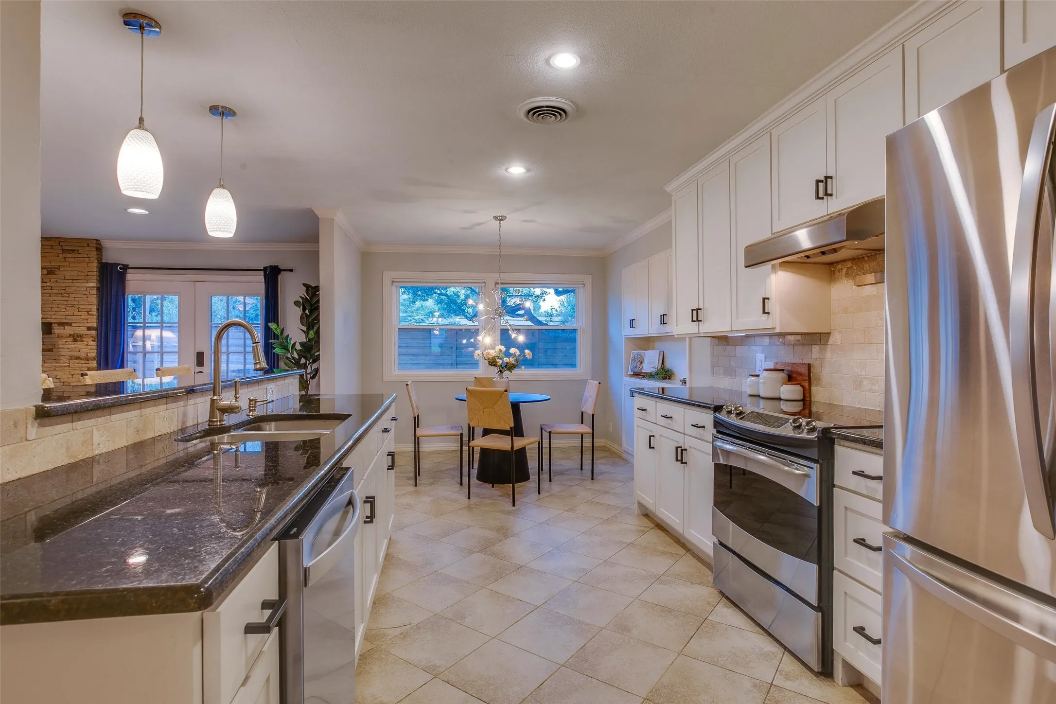 Thoughtfully renovated Kitchen offers exceptional workspace and storage.