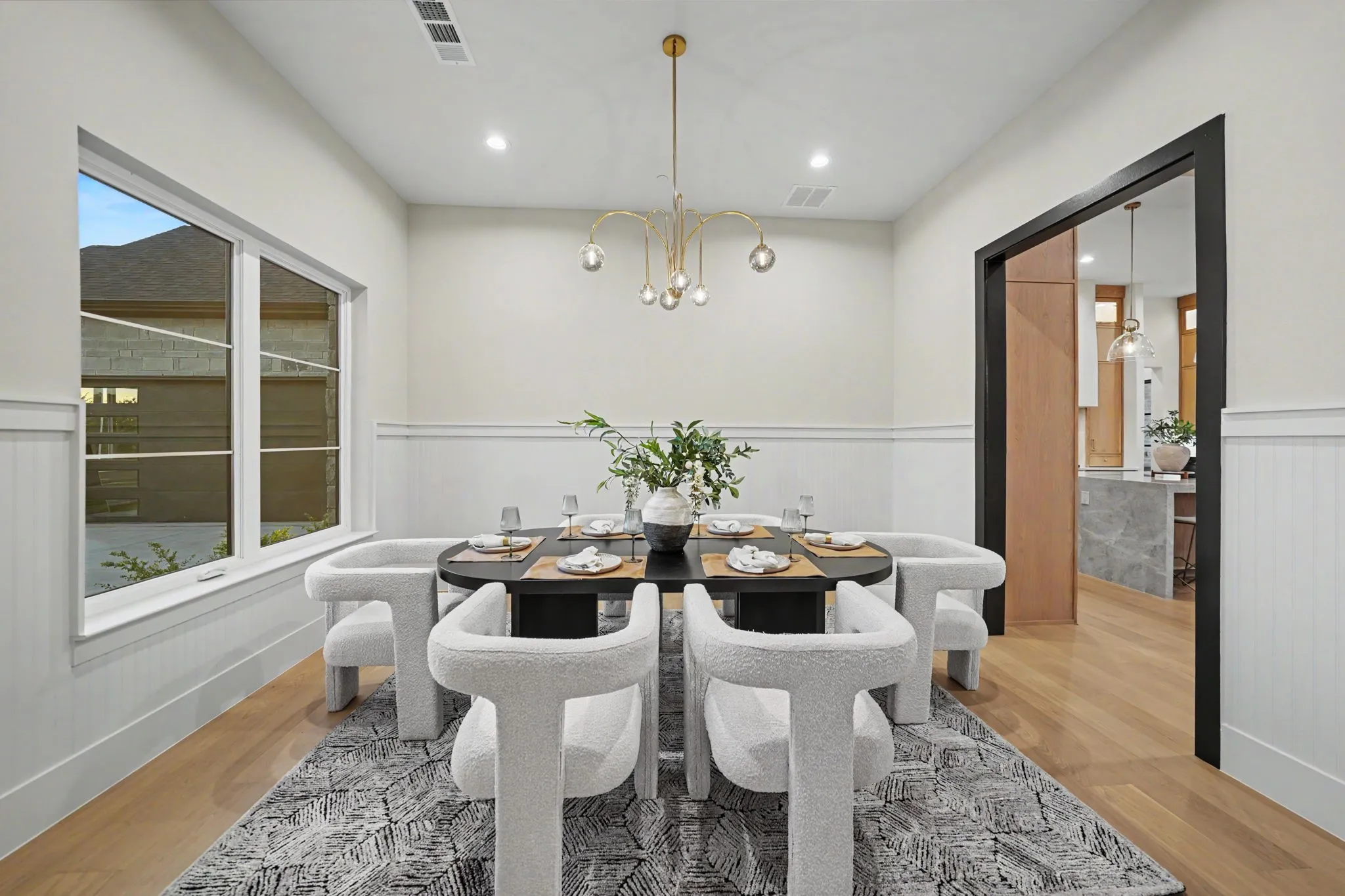 Recessed lighting, wood-finish flooring, and wainscoting