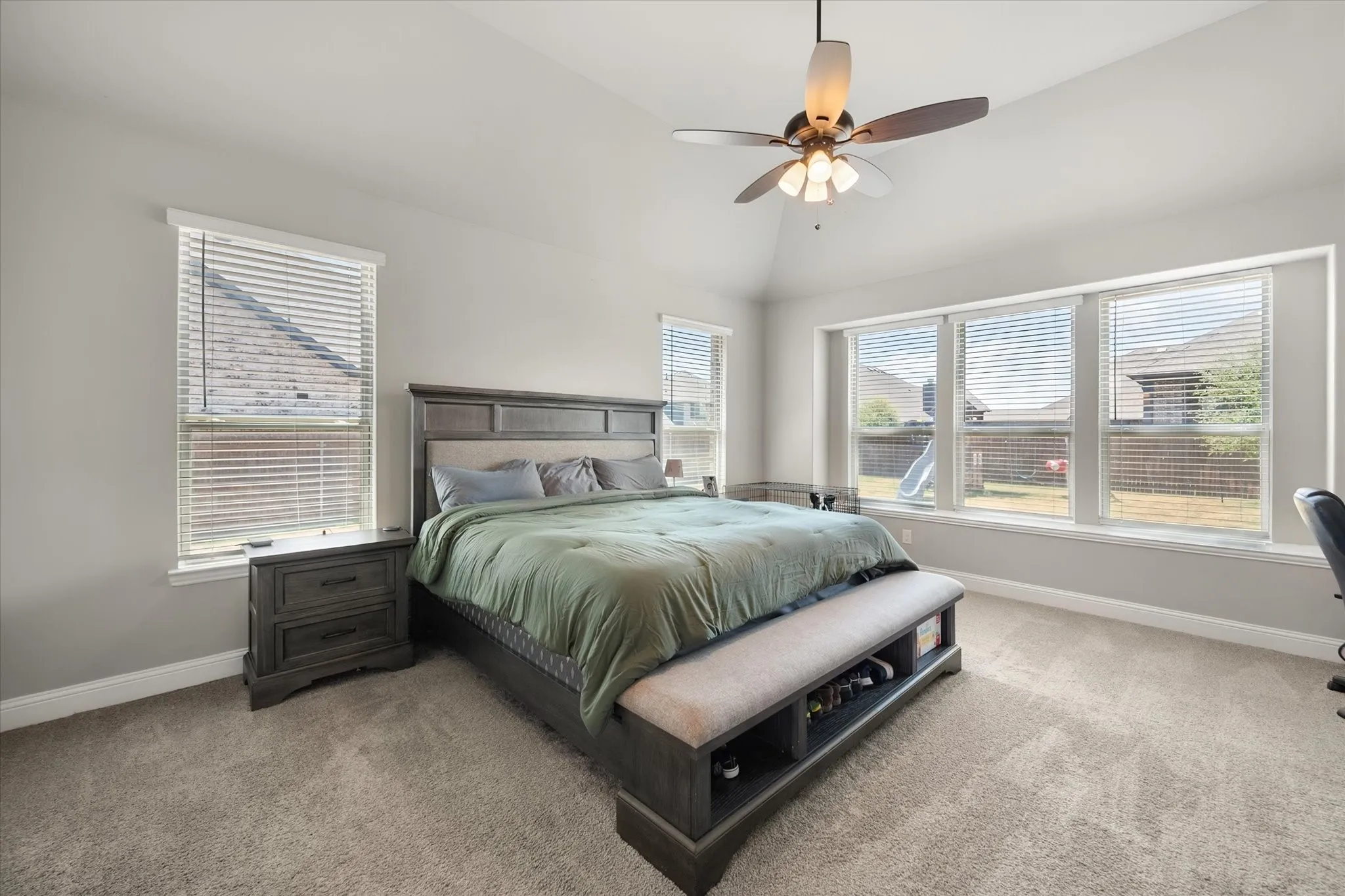 Primary bedroom with bench seating on the windows