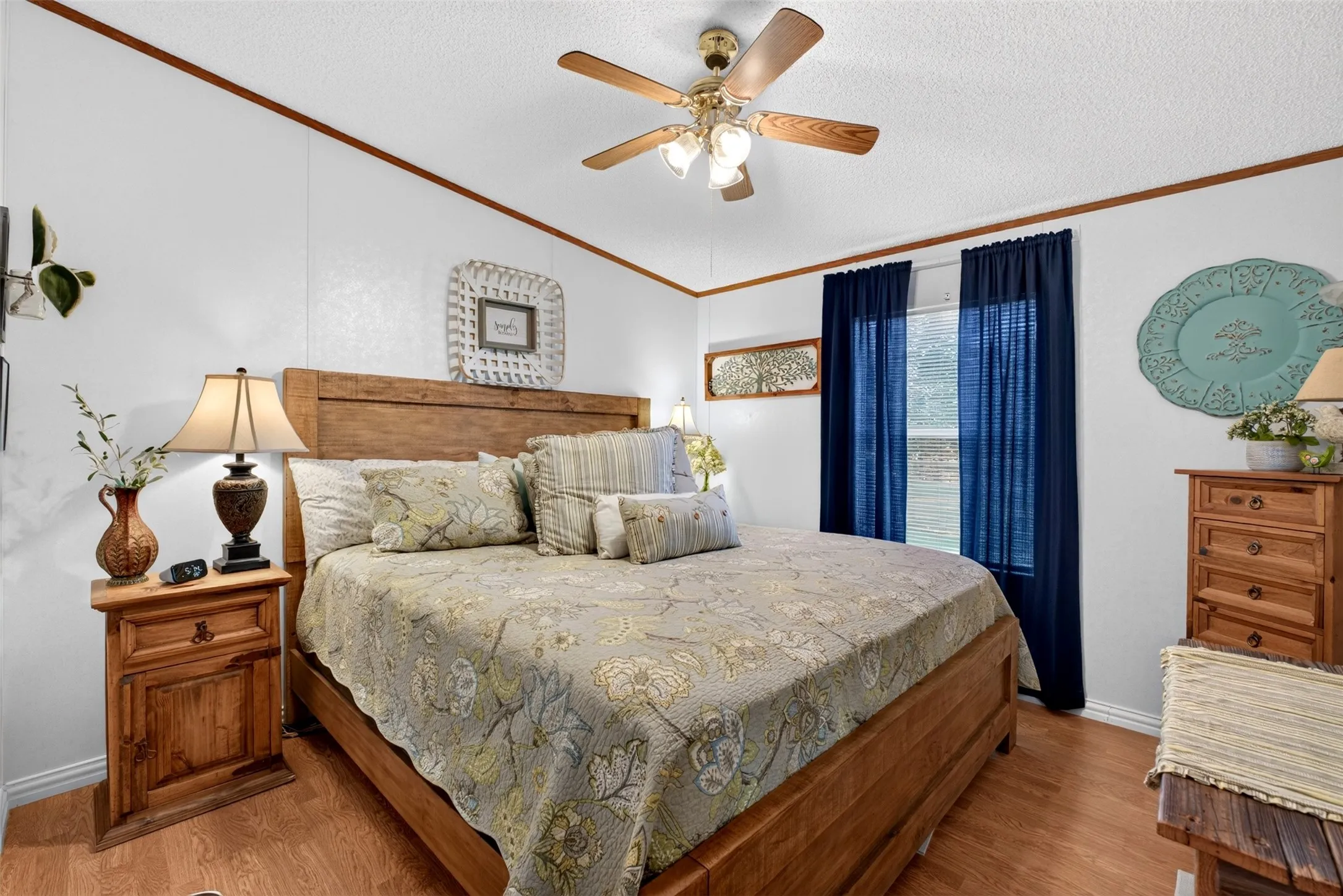 Guestroom 1 with ceiling fan and natural light from window