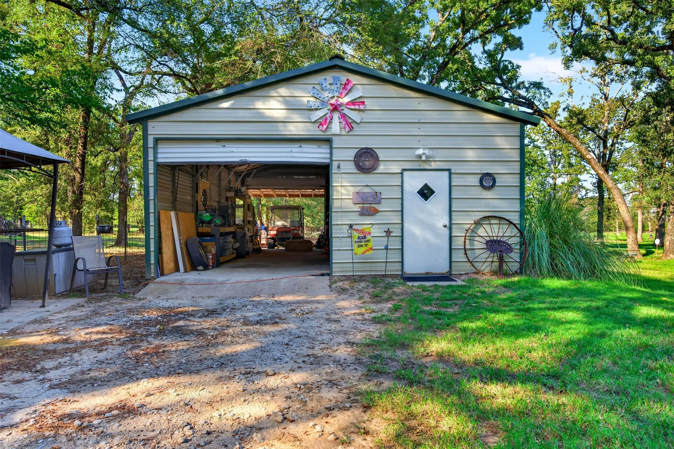 Metal outbuilding with a roll-up garage door and an additional pedestrian entry