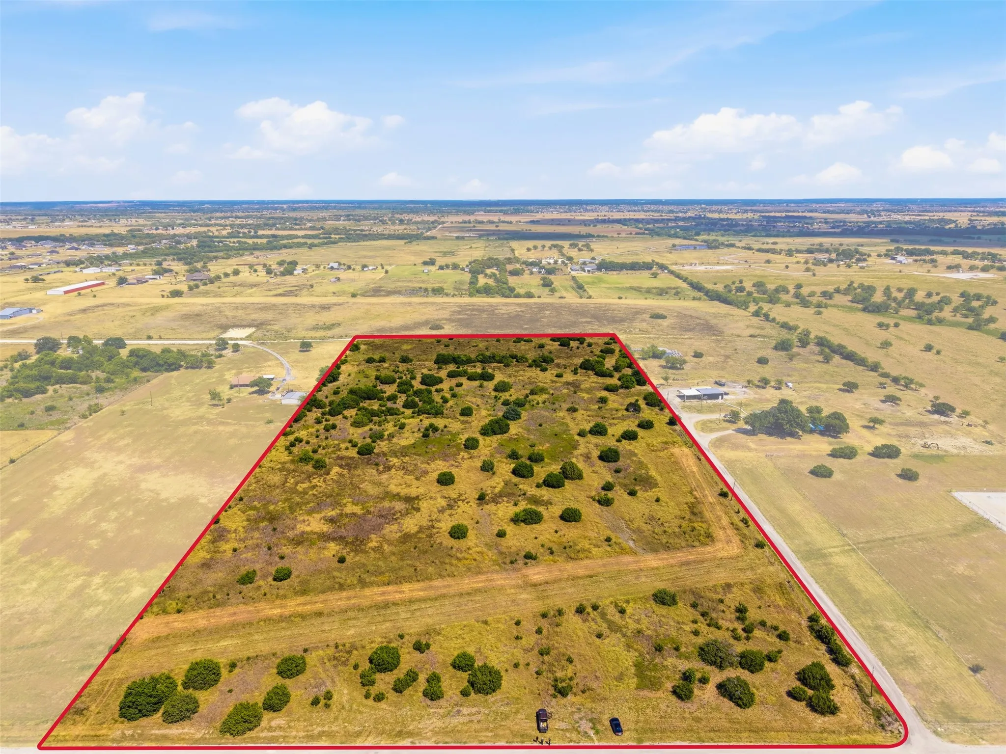 Expansive undeveloped land featuring natural vegetation and open terrain