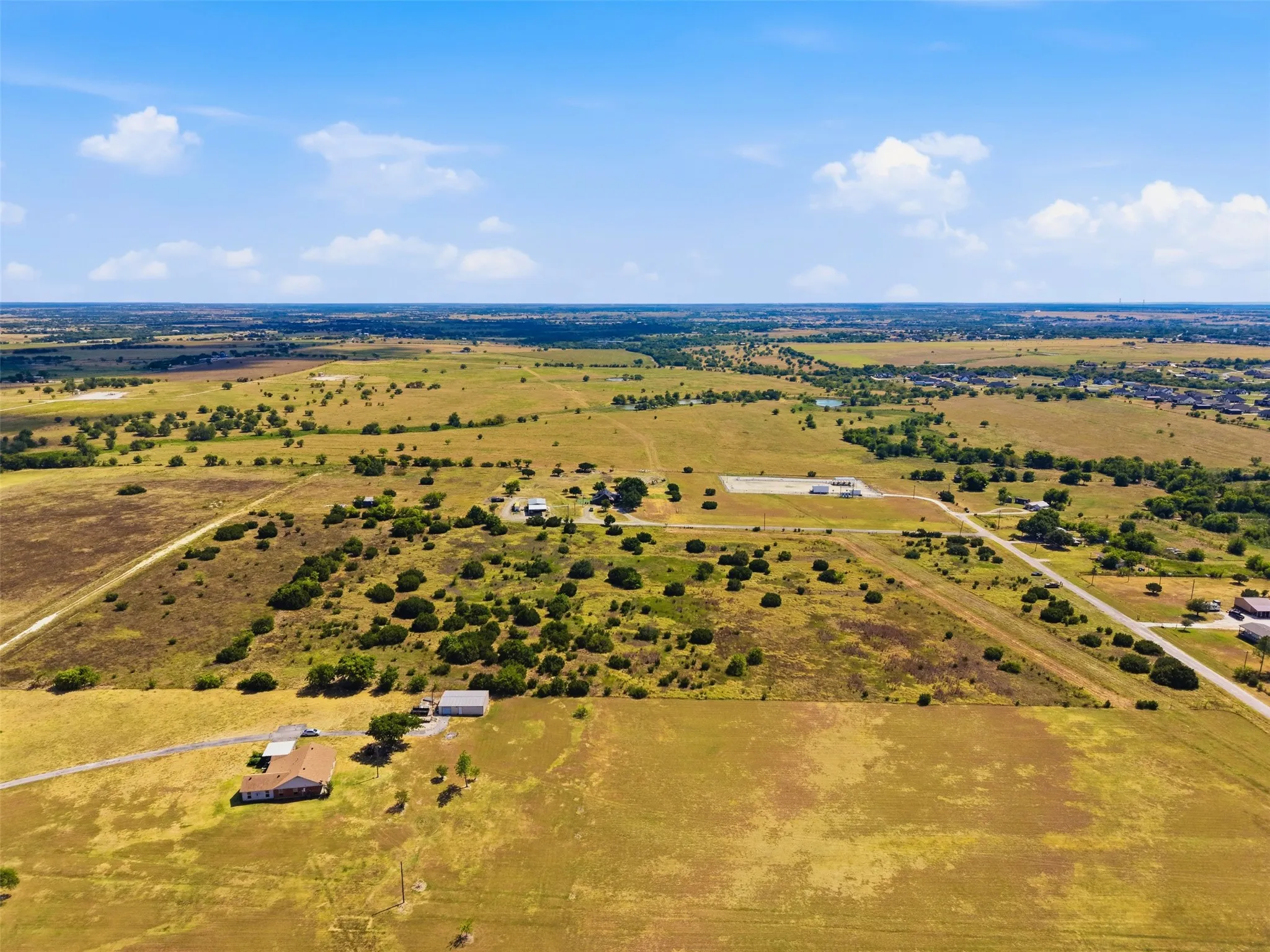 Expansive rural property featuring open fields and scattered trees