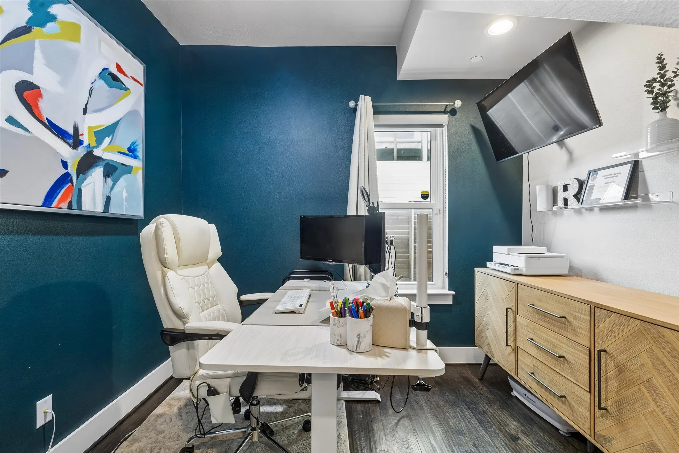 Wood-finish flooring and recessed ceiling lighting.