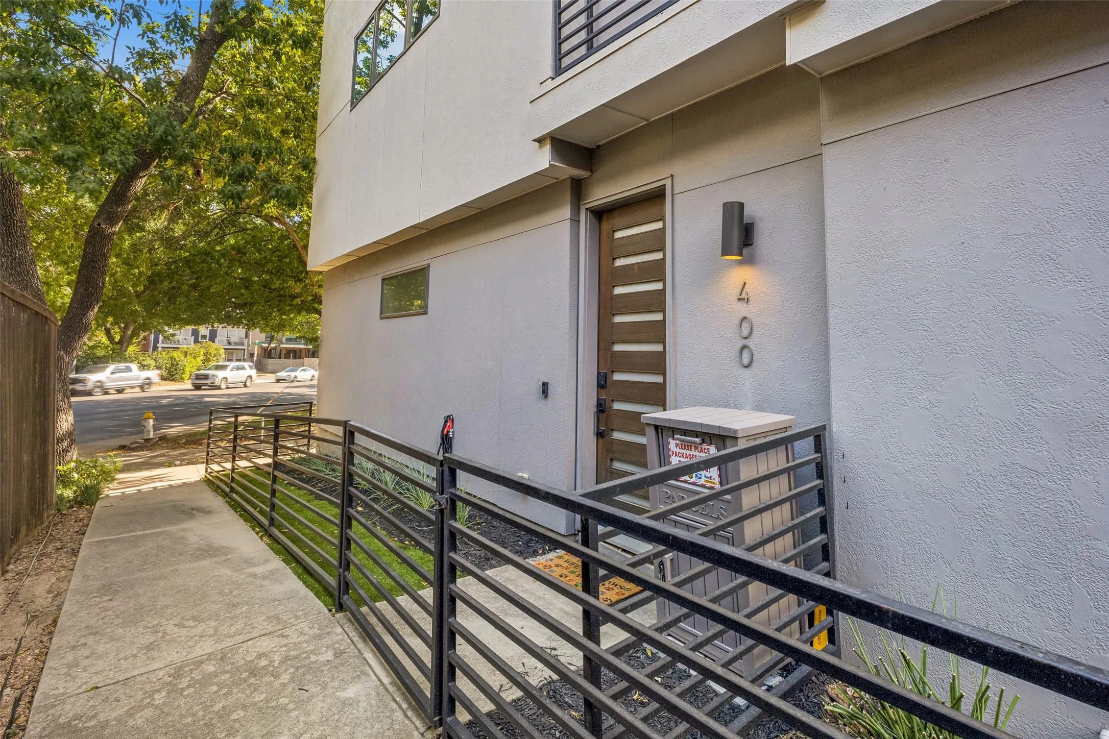 Modern exterior with clean lines, vertical house numbers, and a contemporary entry door