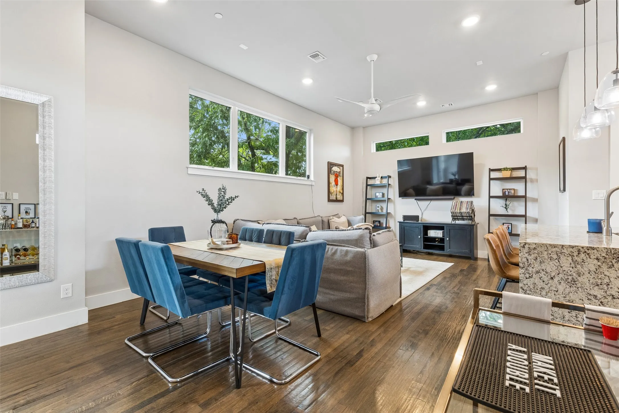 Hardwood-finish flooring throughout the open-concept living area