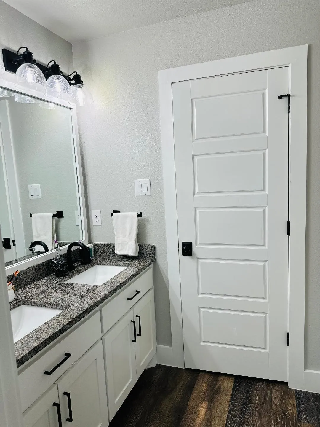 Upstairs features a full bath with a dual-sink vanity.