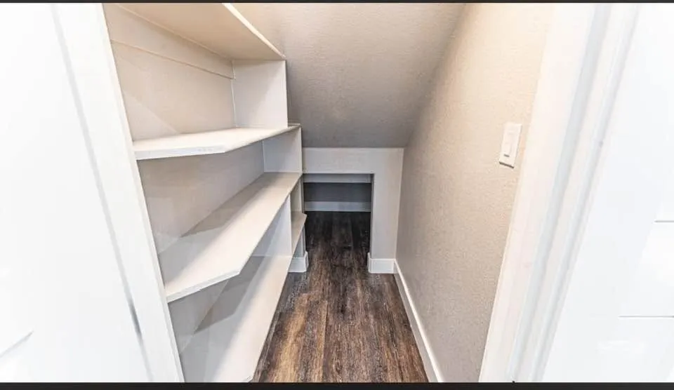 Generous under-stair and pantry storage.