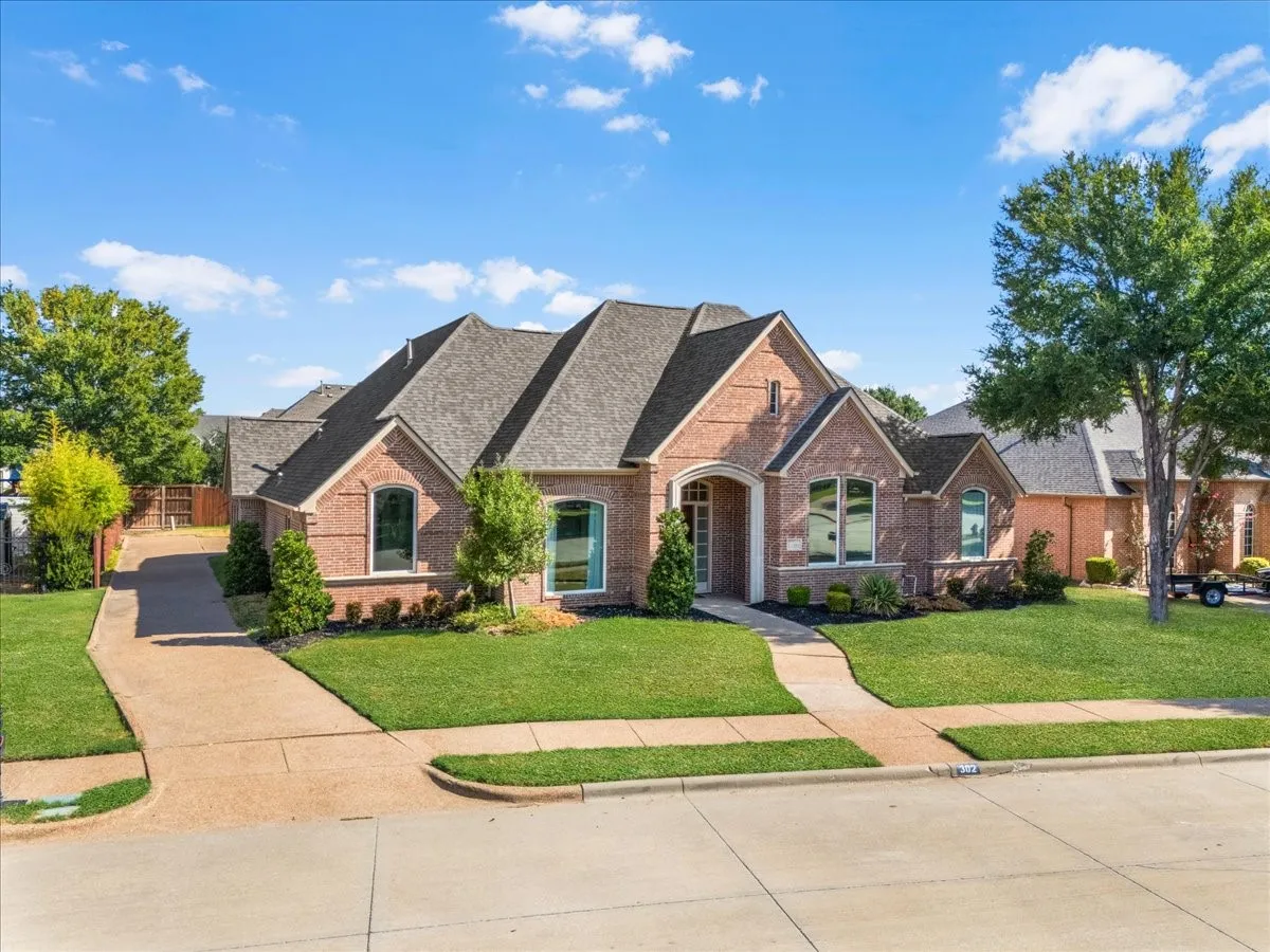 Brick exterior with arched entryways and a covered porch