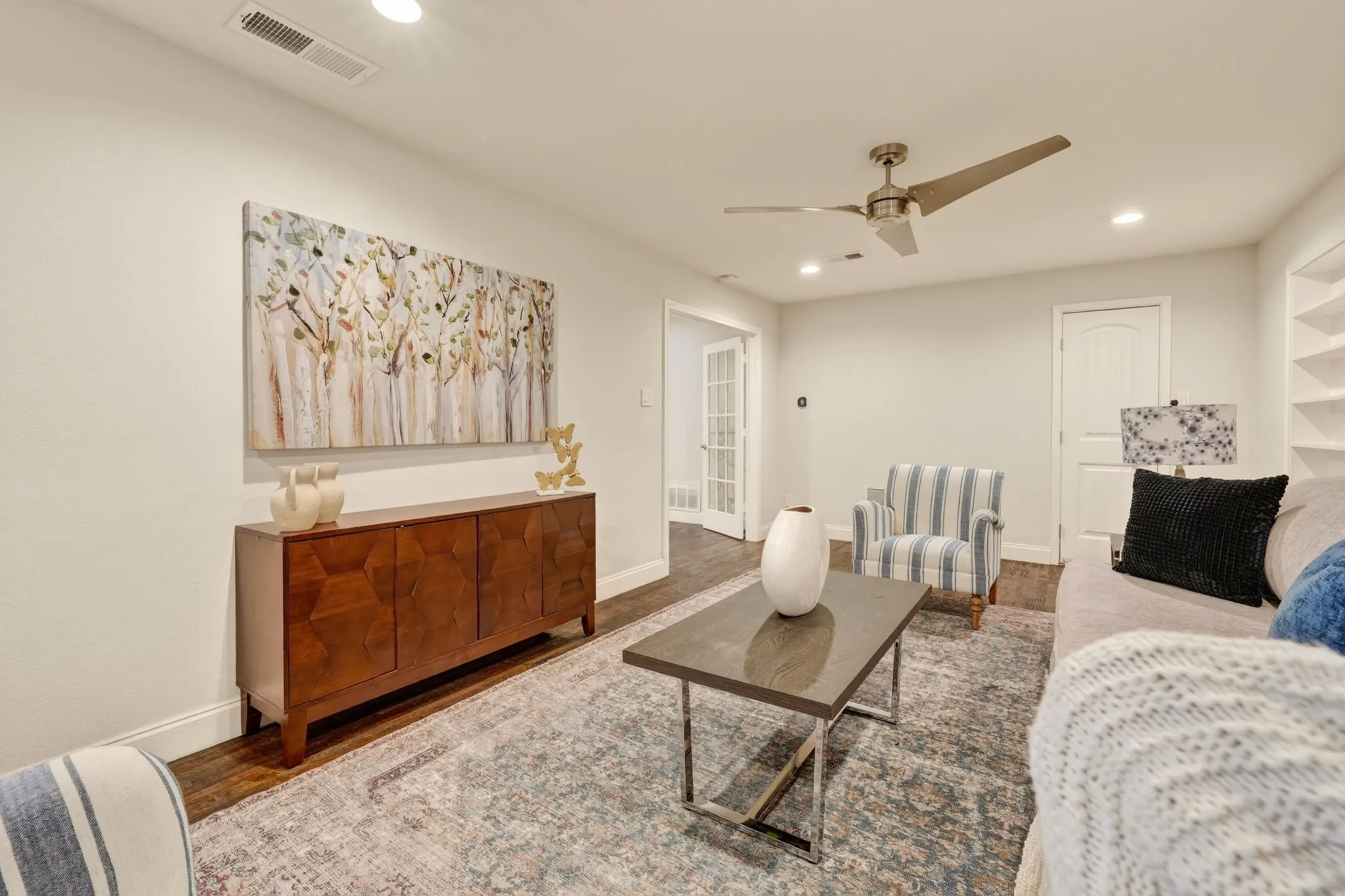 Upstairs Living room/Game room  with Recessed ceiling lighting, a modern ceiling fan, wood flooring, and white interior doors