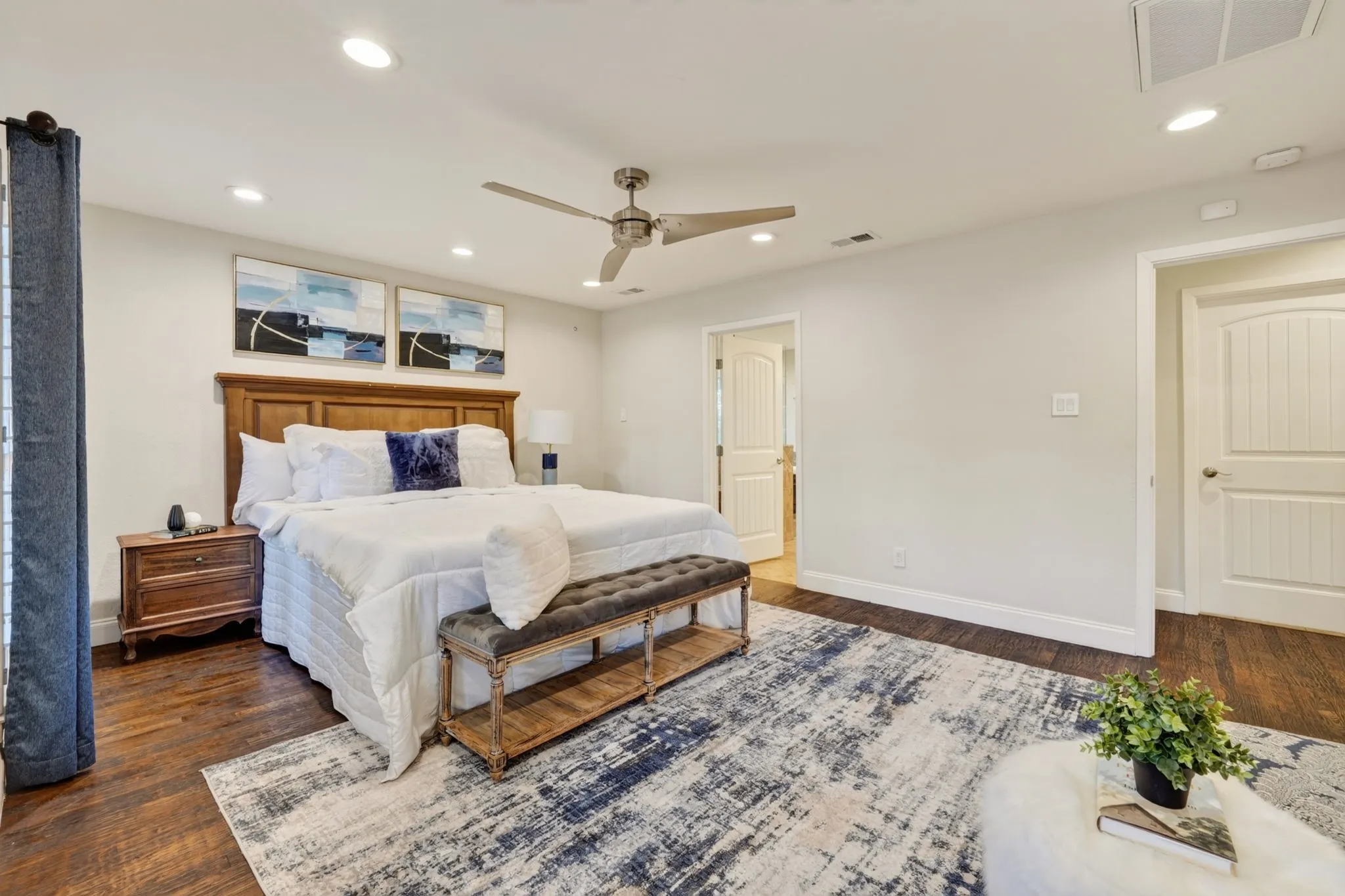 Recessed lighting, ceiling fan, wood flooring, and white interior doors