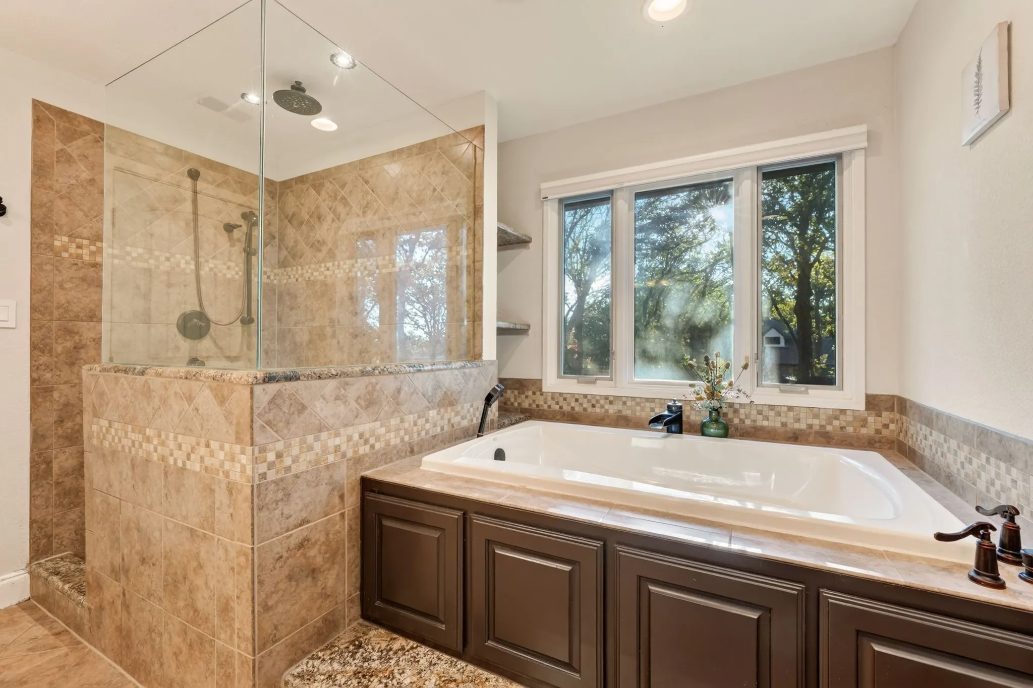 Tile-surround soaking tub with a multi-pane window, separate walk-in shower