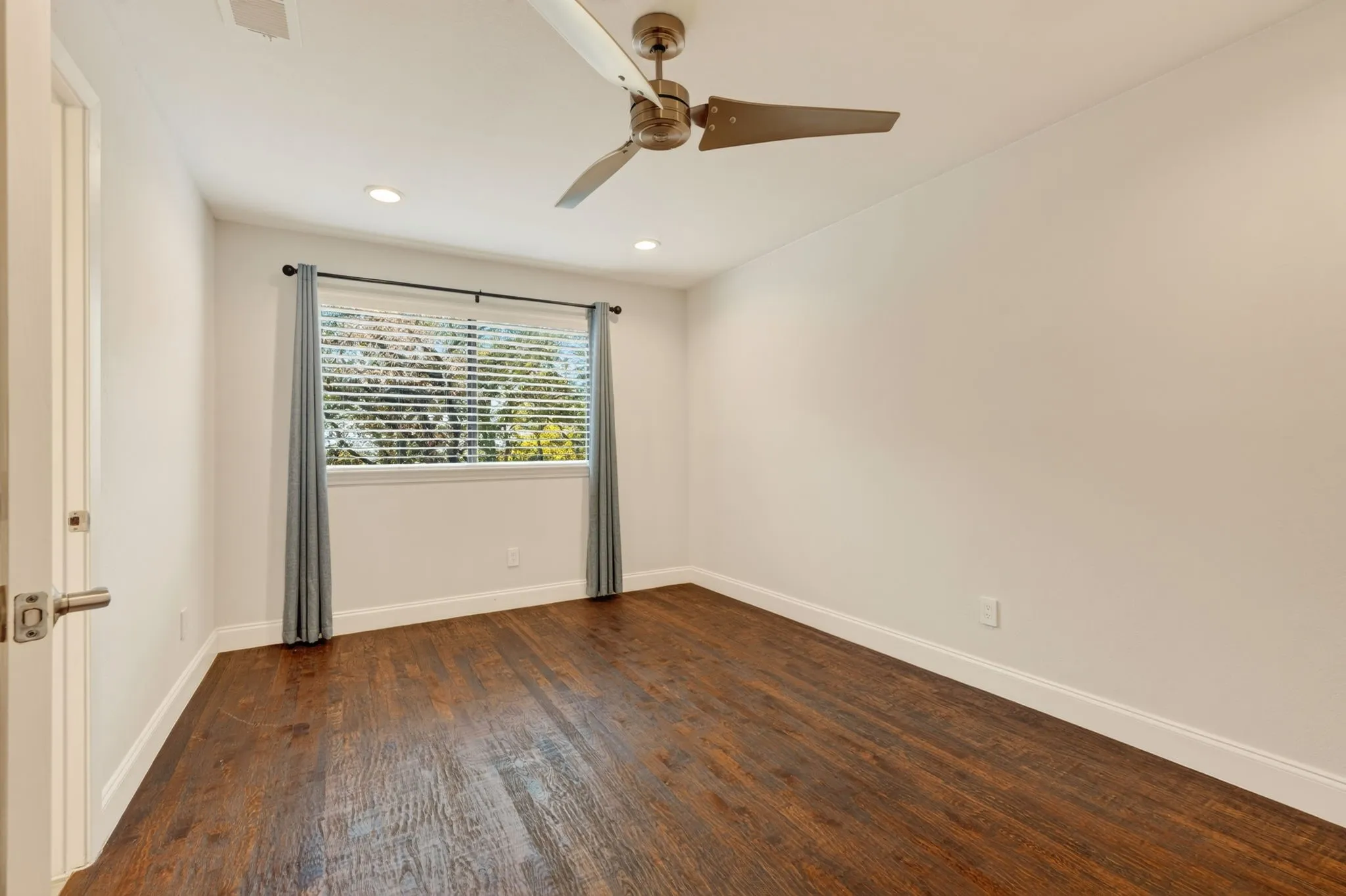 Upstairs Bedroom with Wood flooring, ceiling fan, recessed lighting, and a window featuring horizontal blinds