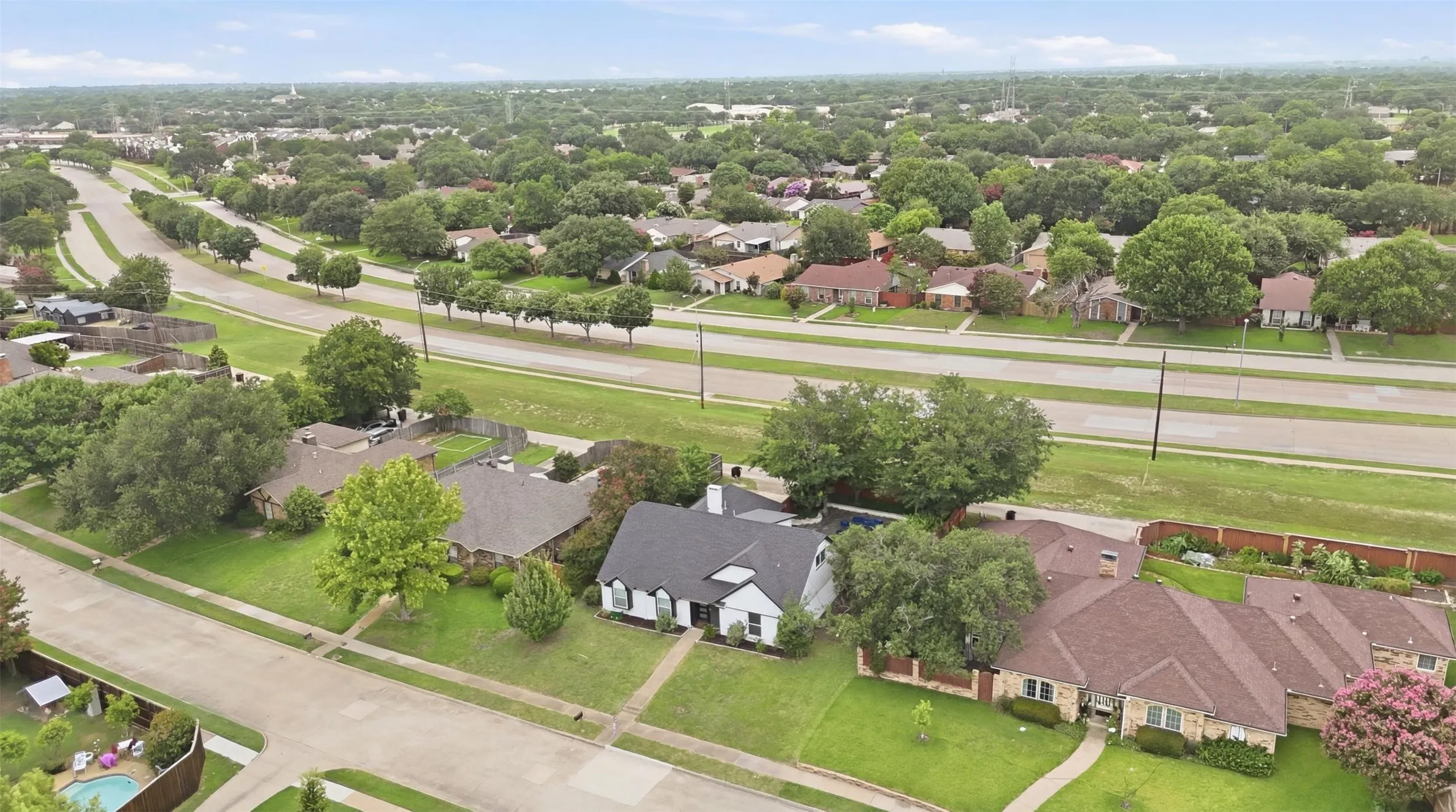 Established residential neighborhood featuring mature trees and expansive green spaces