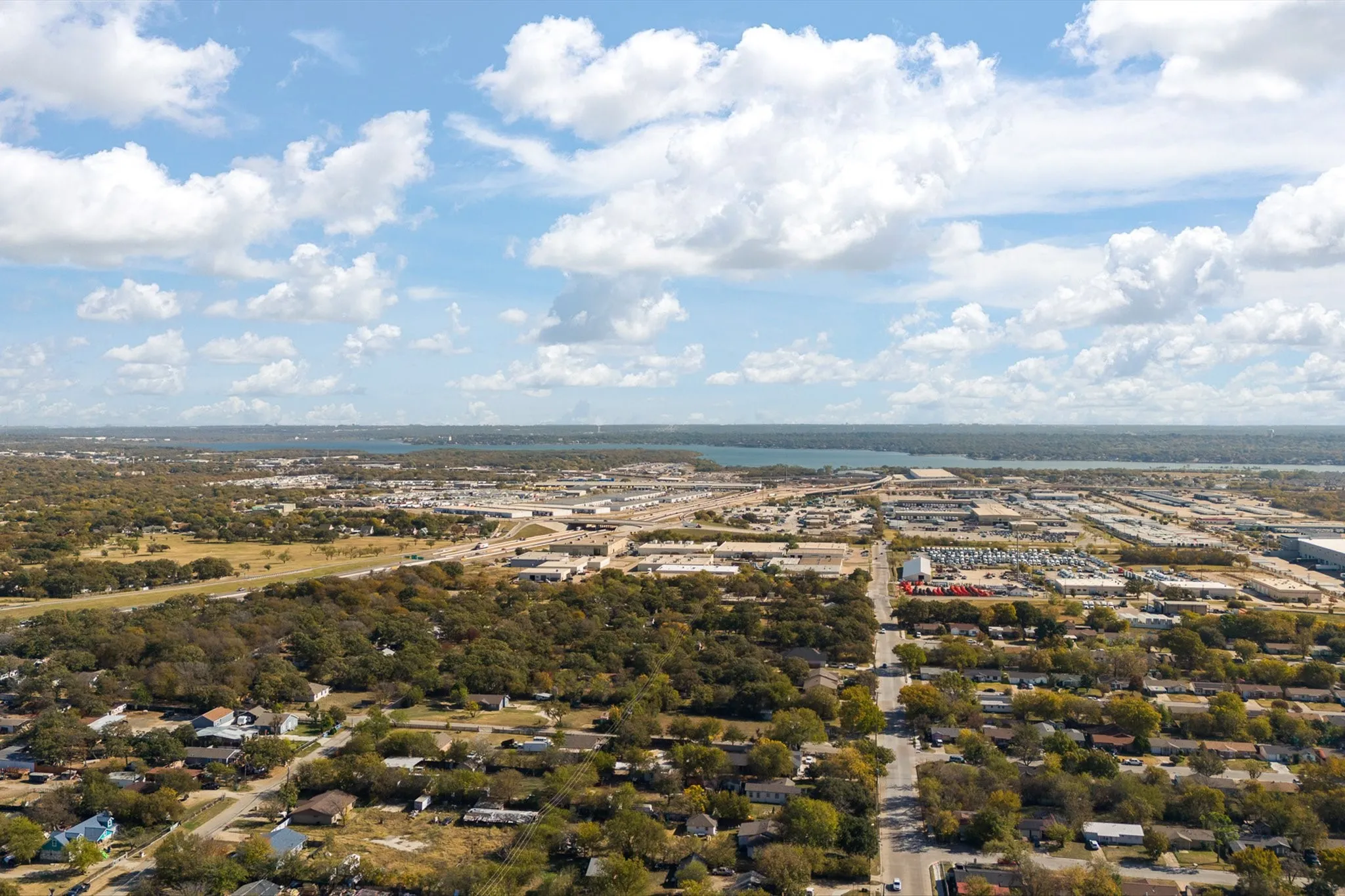 Expansive residential area with a prominent body of water in the background