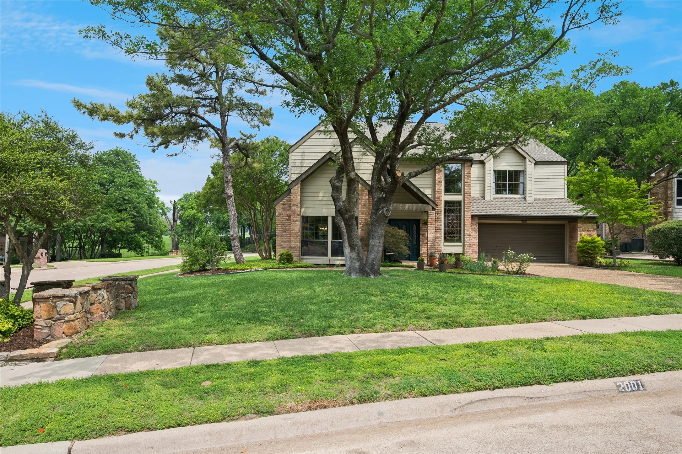 Large retreat on corner lot perfectly positioned with direct view of Sherrill Park's 7th hole.