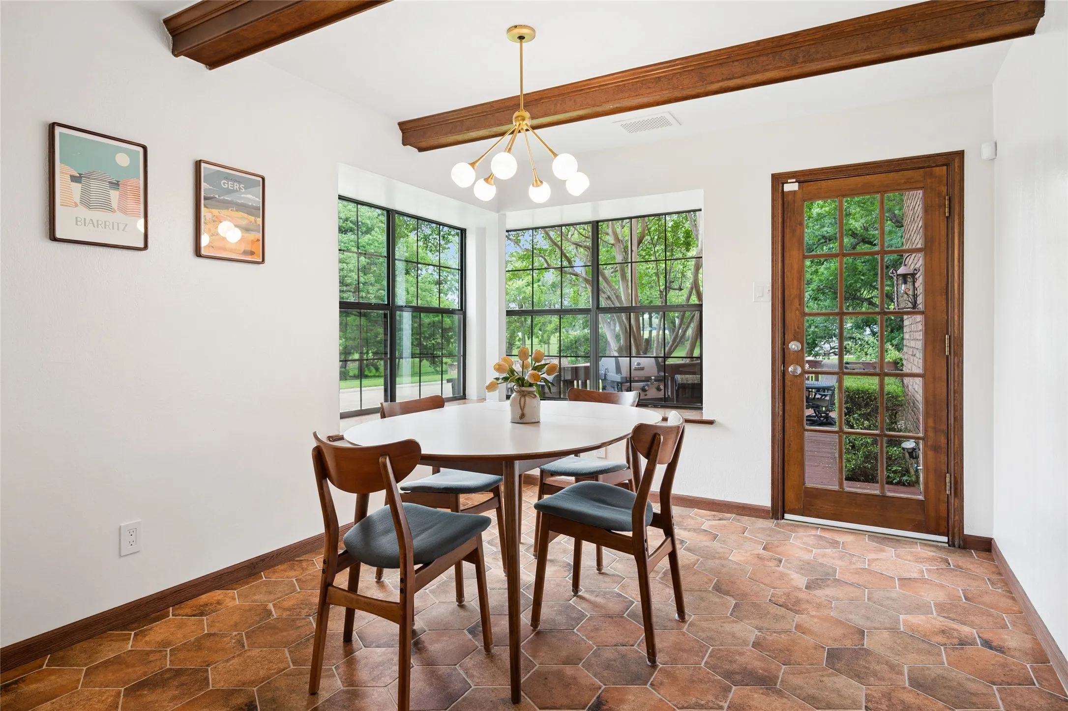 The breakfast area is perfectly positioned just off the kitchen providing a panoramic view of the yard and golf course.