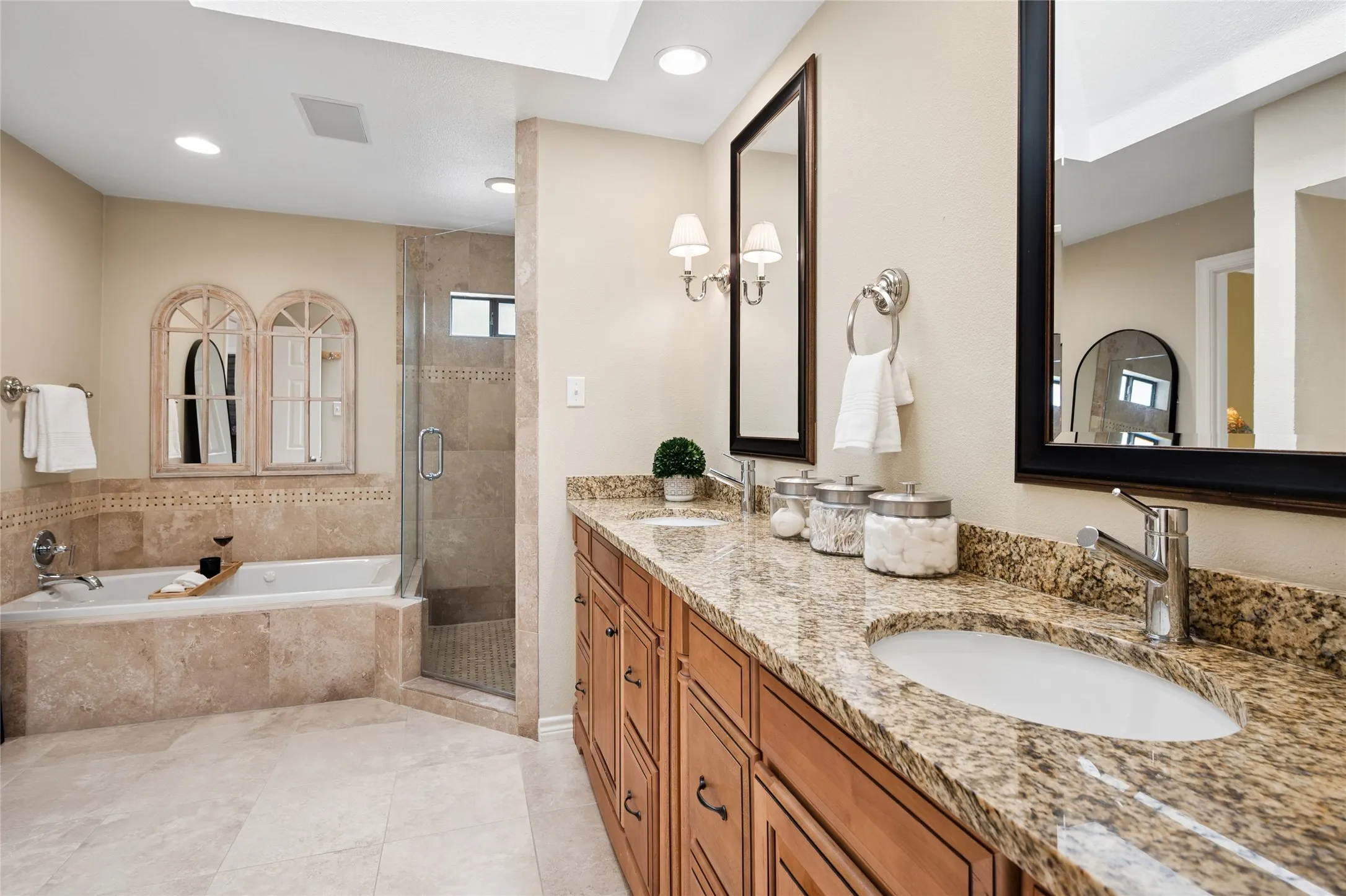 Double sink vanities and granite counters accompany this premium ensuite bathroom.